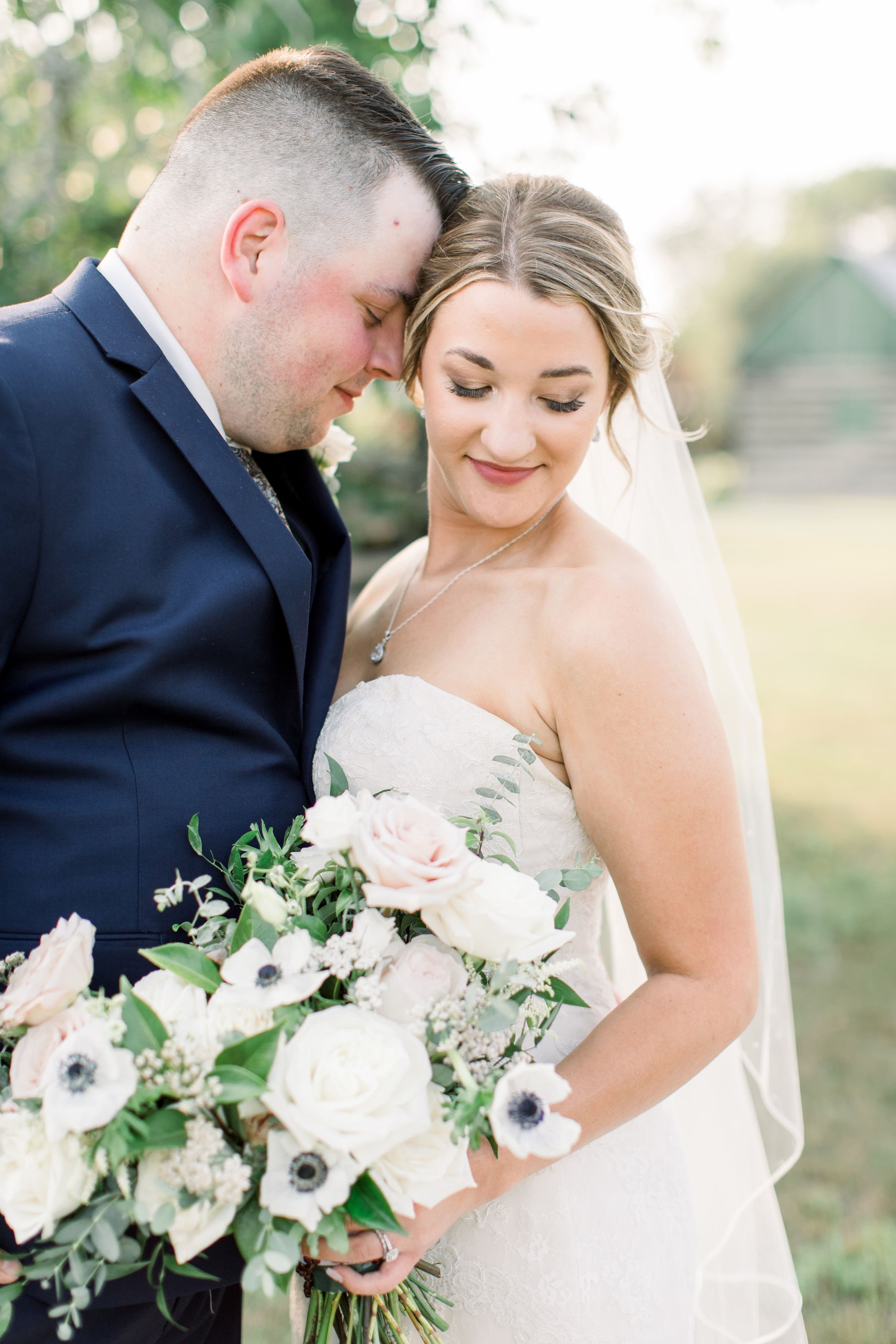  Elegant wedding portrait with the bride looking down and groom snuggling her by Chelsea Mason Photography. bride looking down #StonefieldEstates #Ontarioweddings #Chelseamasonphotography #Chelseamasonengagements #Ontarioweddingphotographers 
