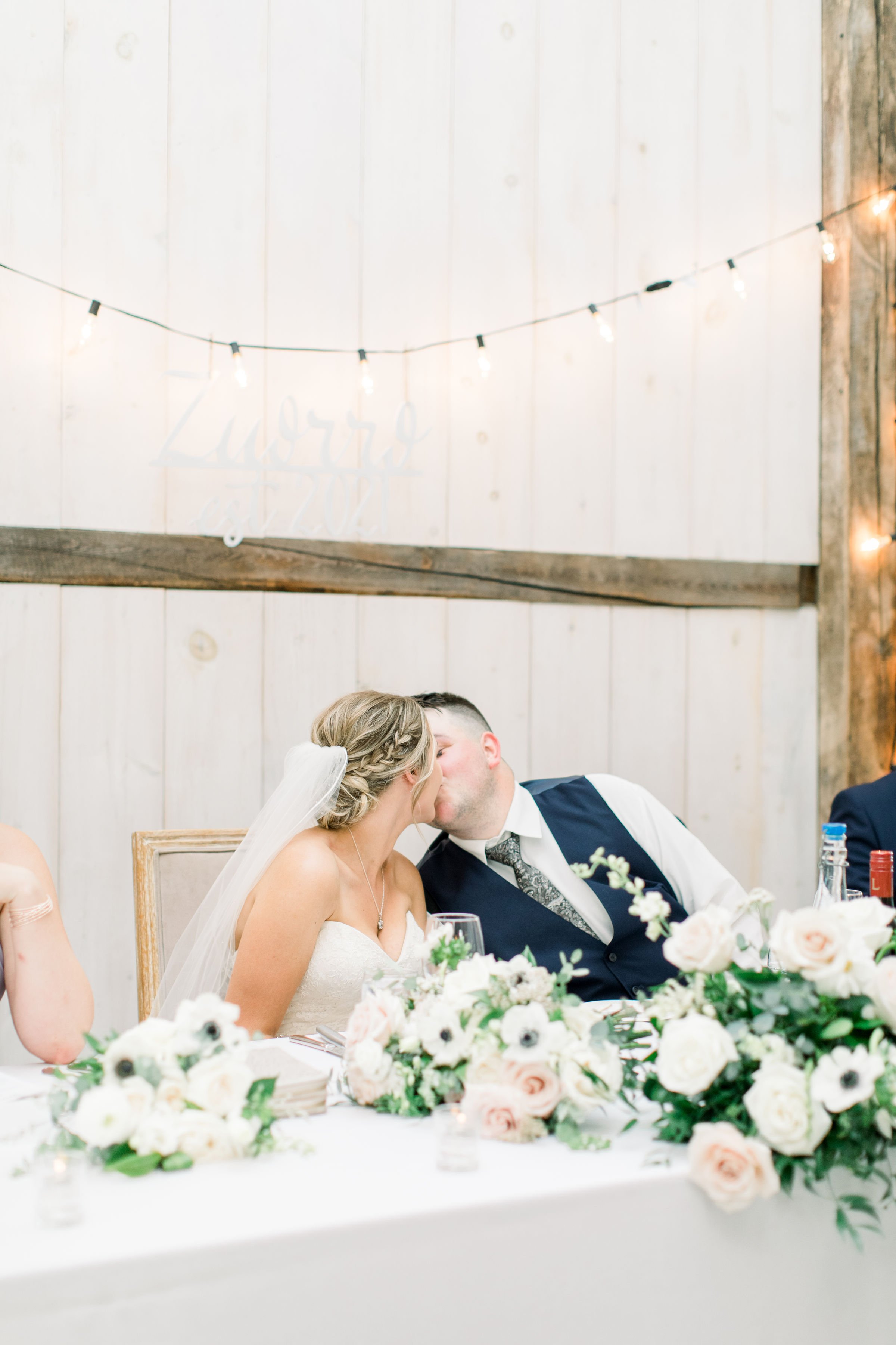  Chelsea Mason Photography captures the bride and groom kissing during the wedding luncheon. wedding luncheon kissing newlyweds #StonefieldEstates #Ontarioweddings #Chelseamasonphotography #Chelseamasonengagements #Ontarioweddingphotographers 
