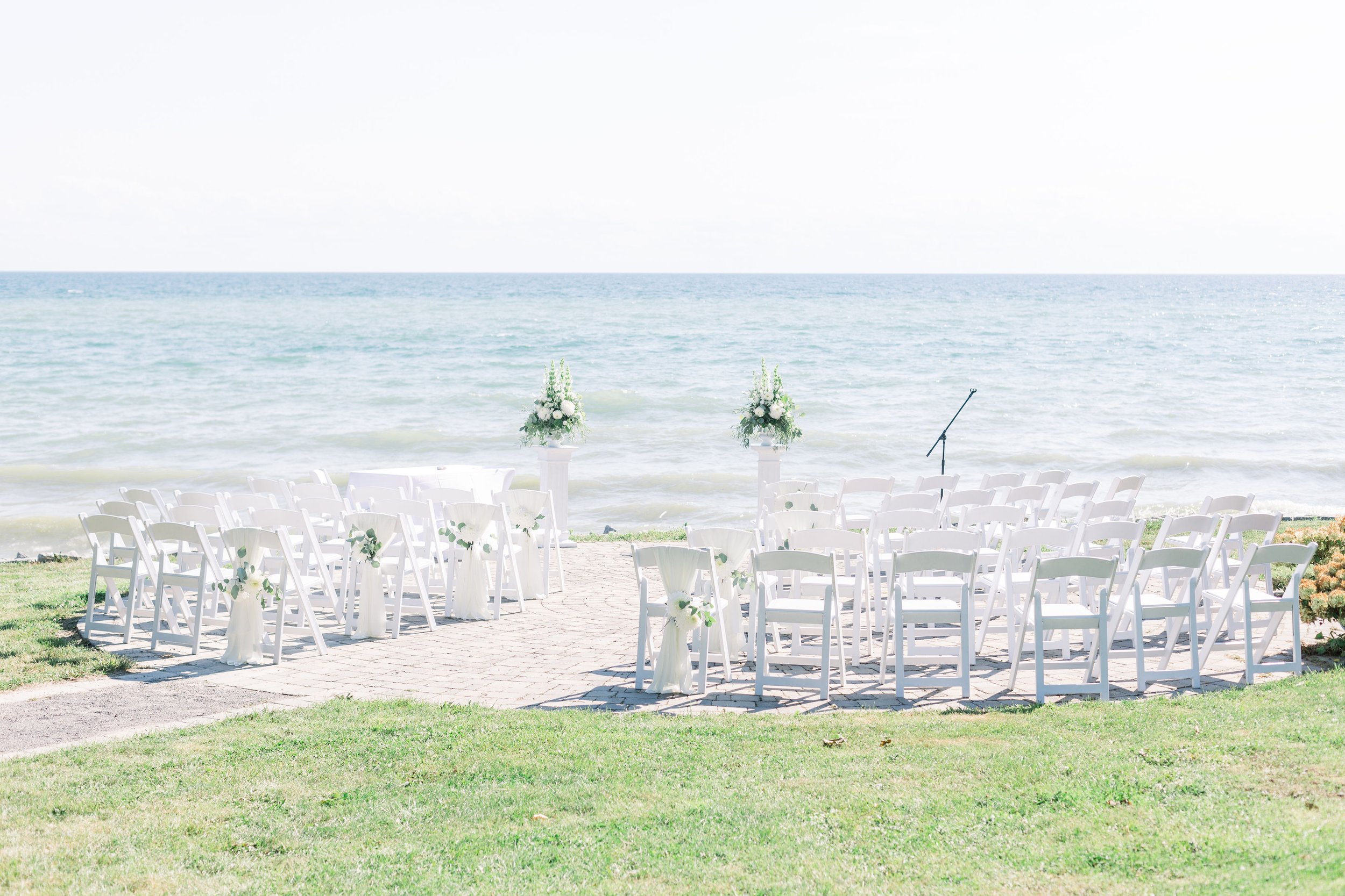  Chelsea Mason Photography captures a wedding location portrait of a wedding on the shores of a lake. lake wedding outdoor wedding ON #ChelseaMasonPhotography #ChelseaMasonWeddings #PrinceEdwardsCountyWeddings #SandbanksWeddings #ONweddingphotographe