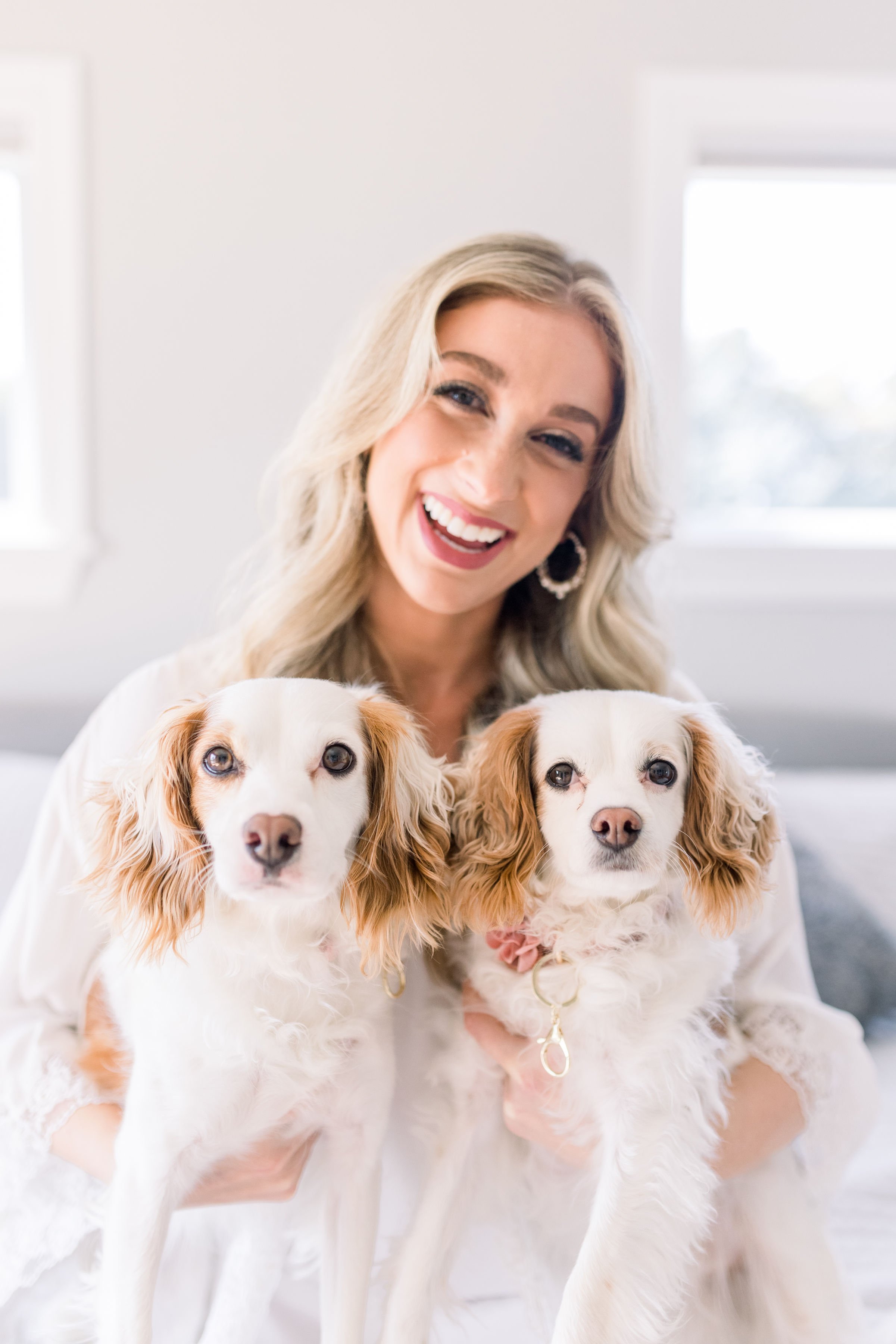  Chelsea Mason Photography captures a bride with her two dogs in the bridal suite. dogs in weddings bride and dogs puppy #ChelseaMasonPhotography #ChelseaMasonWeddings #PrinceEdwardsCountyWeddings #SandbanksWeddings #ONweddingphotographer 