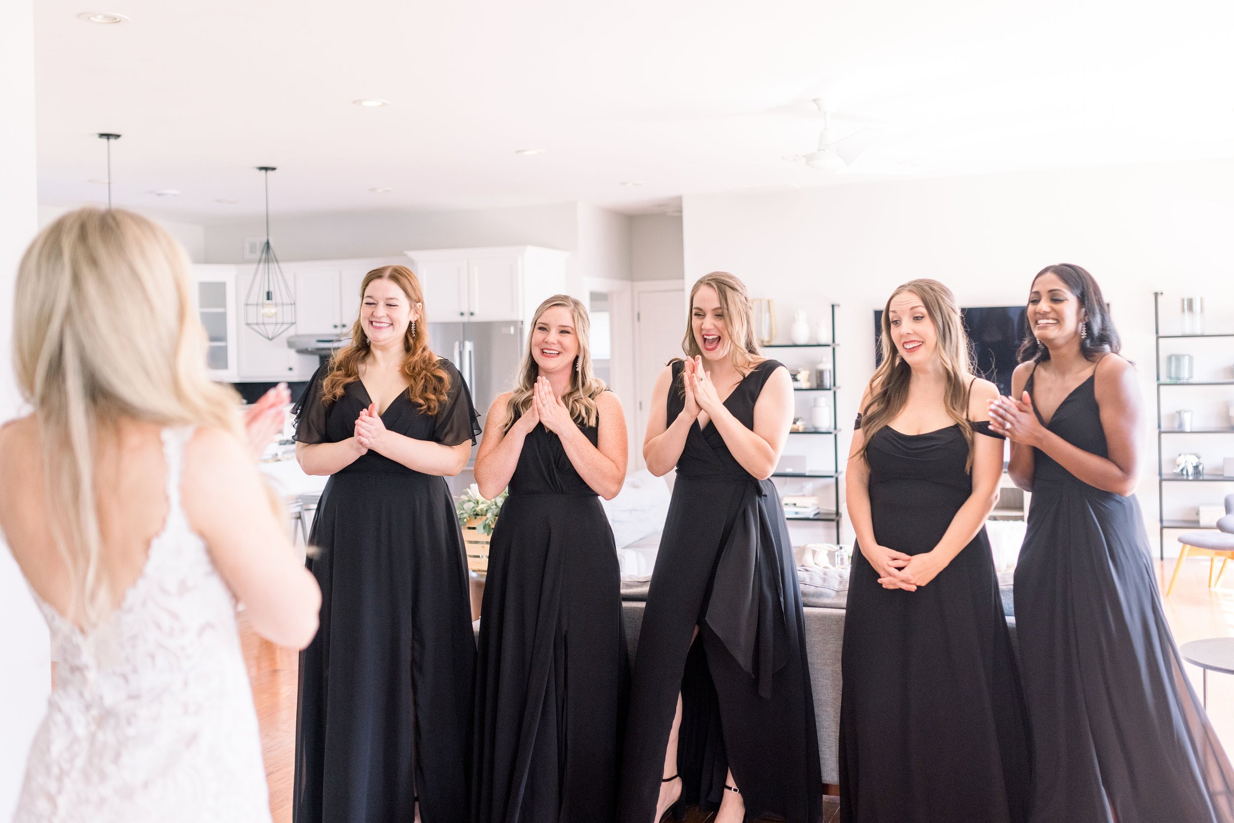  Bridesmaids get a first look at the bride in her wedding gown by Chelsea Mason Photography. first look with bridesmaids #ChelseaMasonPhotography #ChelseaMasonWeddings #PrinceEdwardsCountyWeddings #SandbanksWeddings #ONweddingphotographer 