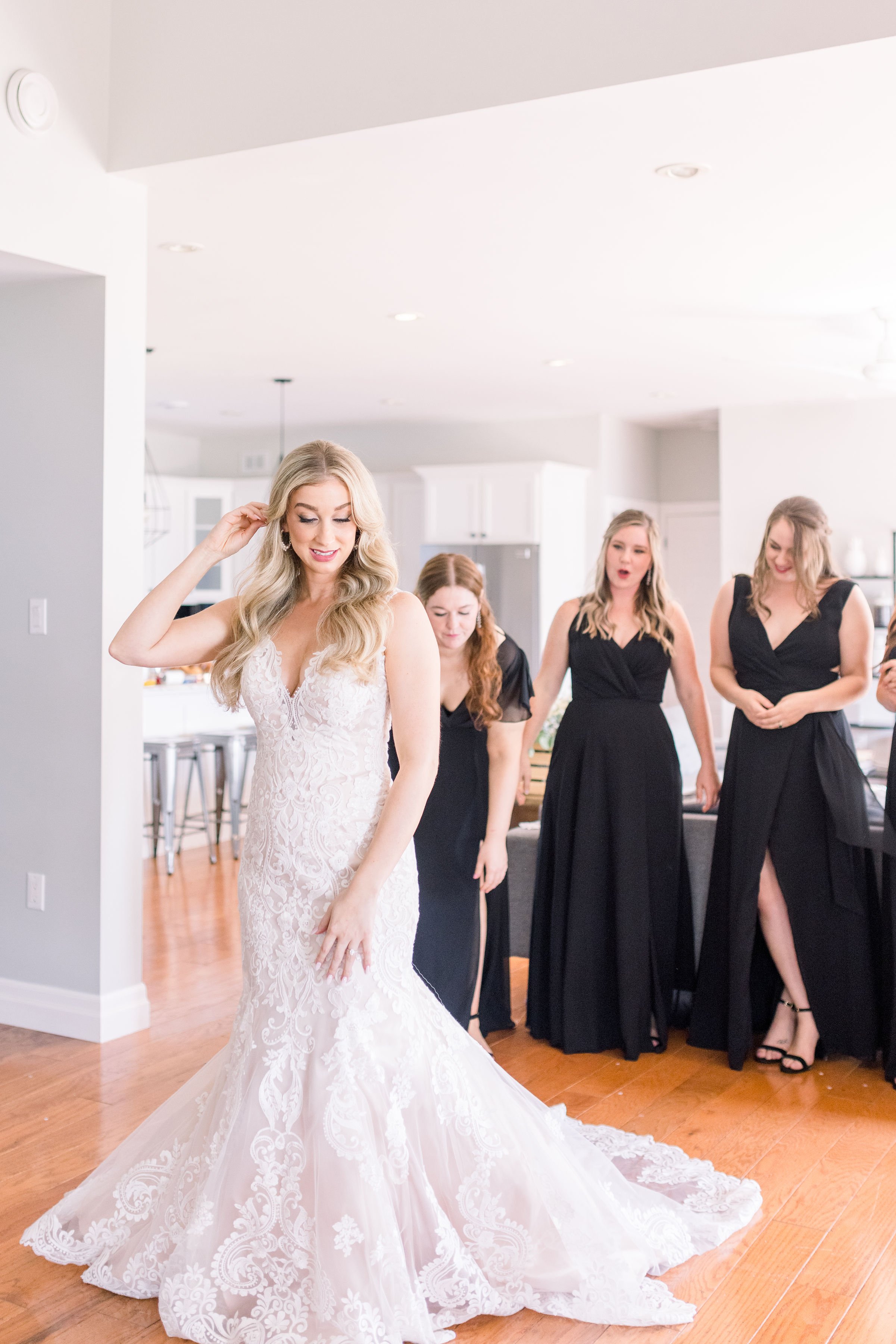  During a wedding in Sandbanks, Chelsea Mason Photography captures a bride twirling for the bridesmaids. mermaid wedding gown #ChelseaMasonPhotography #ChelseaMasonWeddings #PrinceEdwardsCountyWeddings #SandbanksWeddings #ONweddingphotographer 