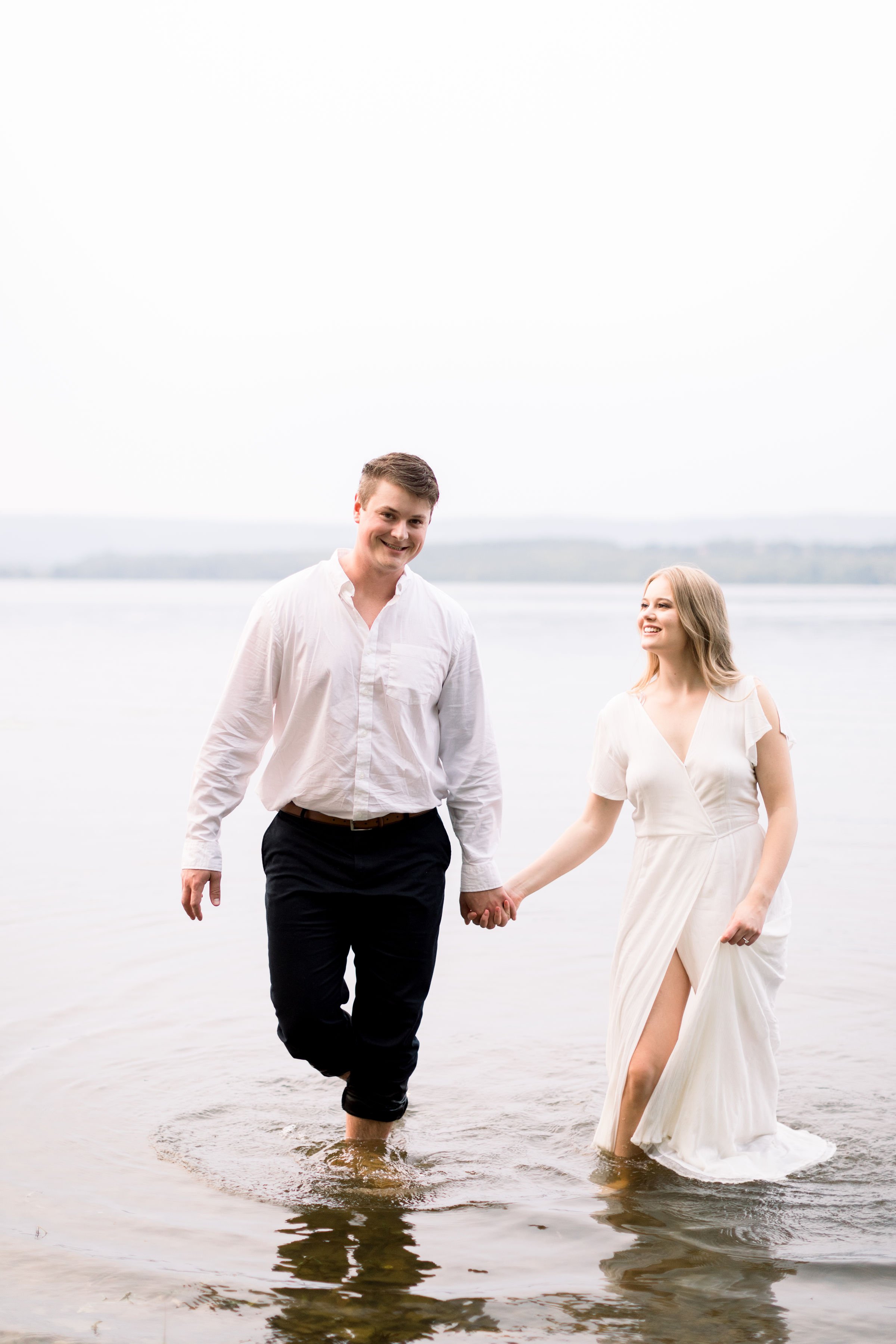  Walking together a man and woman look into one another's eyes by Chelsea Mason Photography. completely in love soon to be married engaged #ChelseaMasonPhotography #ChelseaMasonEngagements #PinheysPointEngagements #OttawaEngagementPhotography 