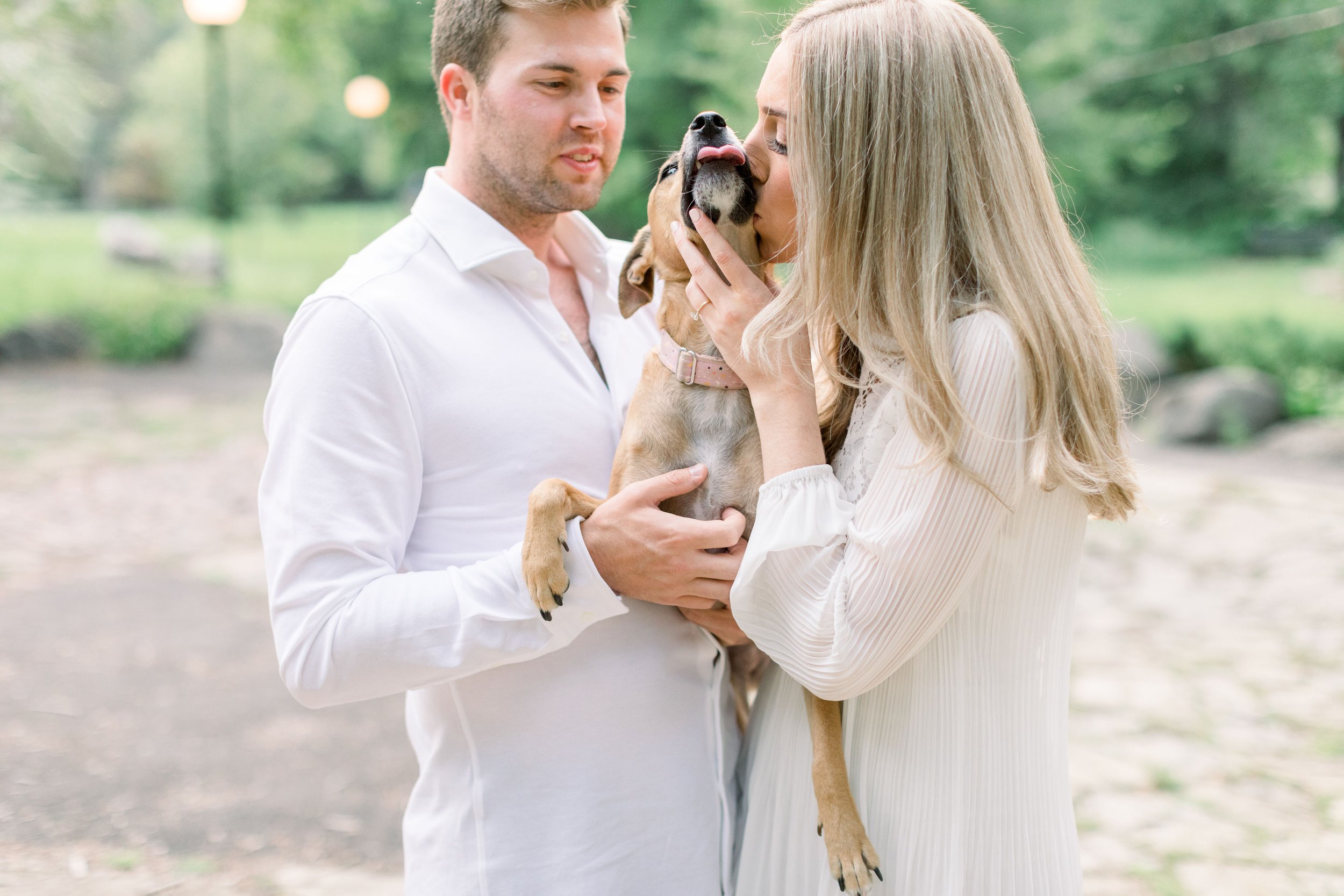  In an Ottawa park, a woman gives her dog a kiss captured by Chelsea mason photography. woman dog kisses style ideas matching #Ottawaengagements #Ottawaweddingphotographers #engagementwithdogs #ChelseaMasonPhotography #ChelseaMasonEngagements  