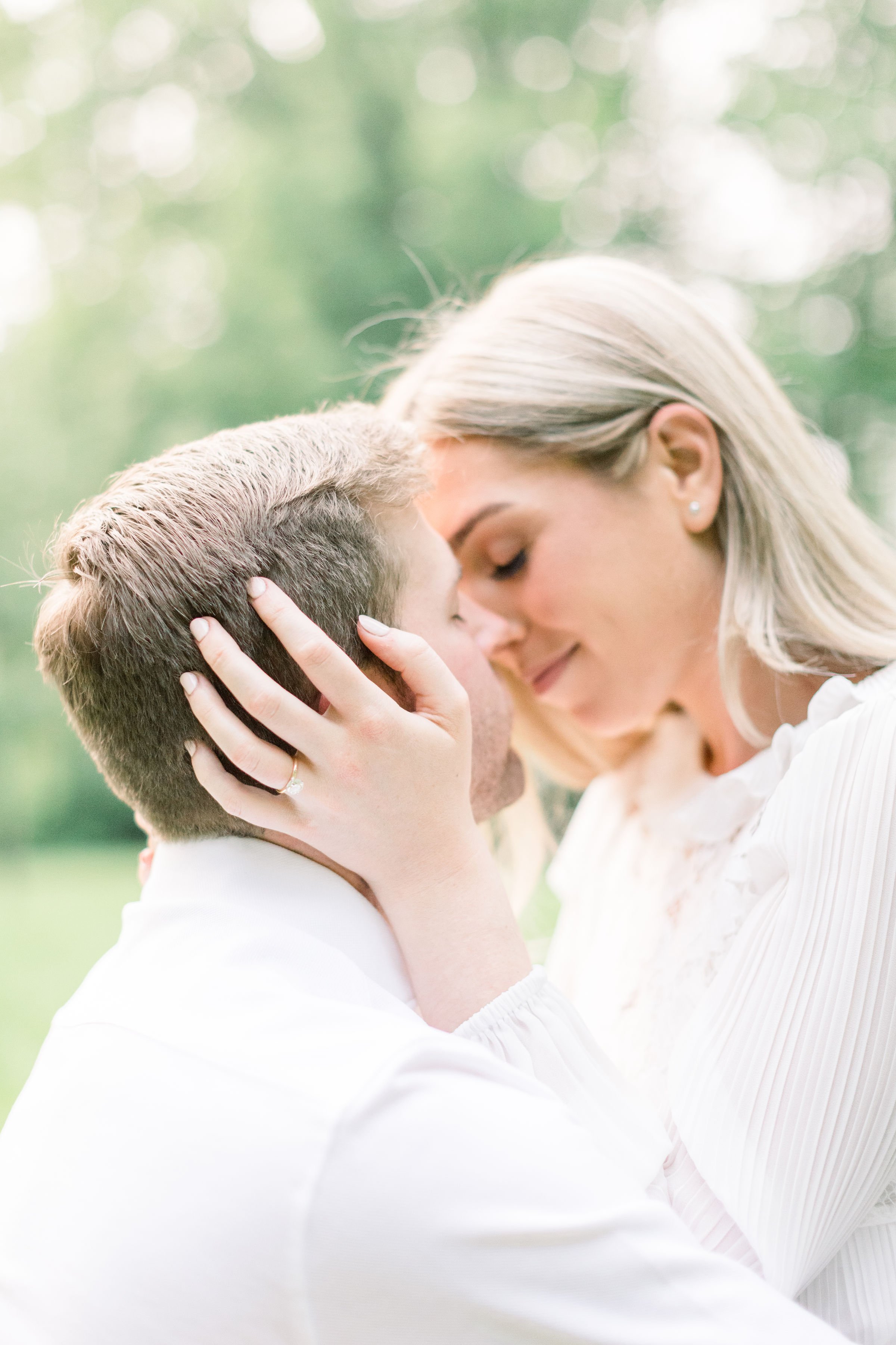  Clean crisp portrait of a woman going in for a kiss by Chelsea Mason Photography. kissing engagements Ottawa engagement bright light #Ottawaengagements #Ottawaweddingphotographers #engagementwithdogs #ChelseaMasonPhotography #ChelseaMasonEngagements