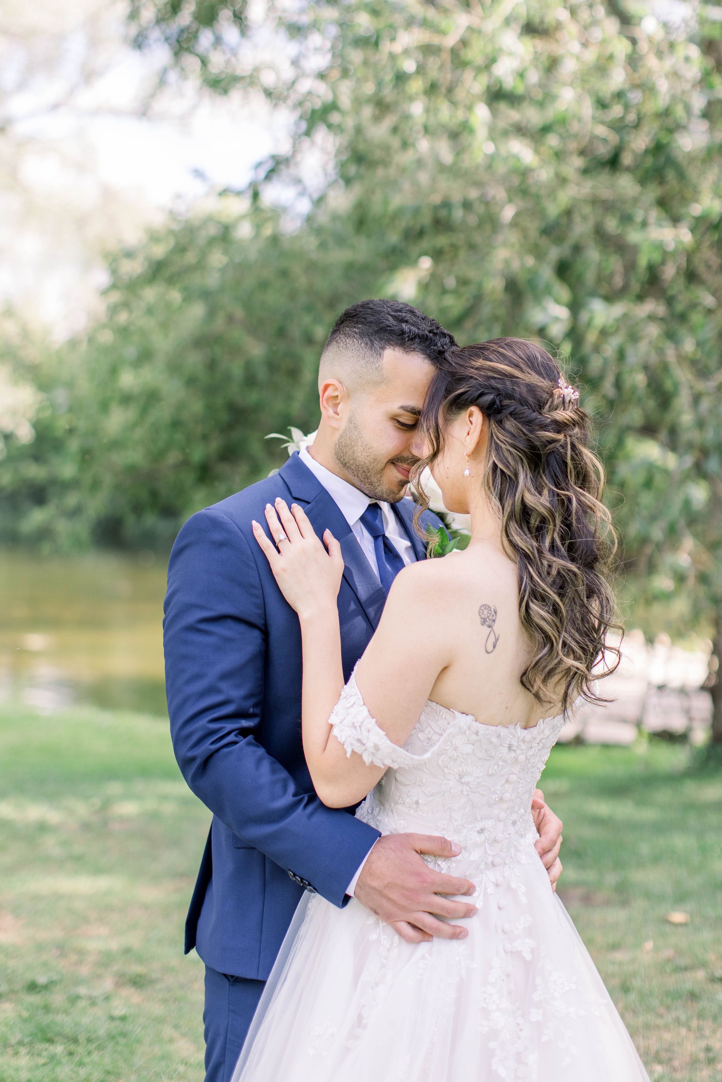  Chelsea Mason Photography captures a bride wearing an off-the-shoulder wedding gown showing off her shoulder tattoo. tattoo wed dress #ChelseaMasonPhotography #ChelseaMasonWeddings #FairmontChateauLaurier #OttawaWeddings #OttawaPhotographers 