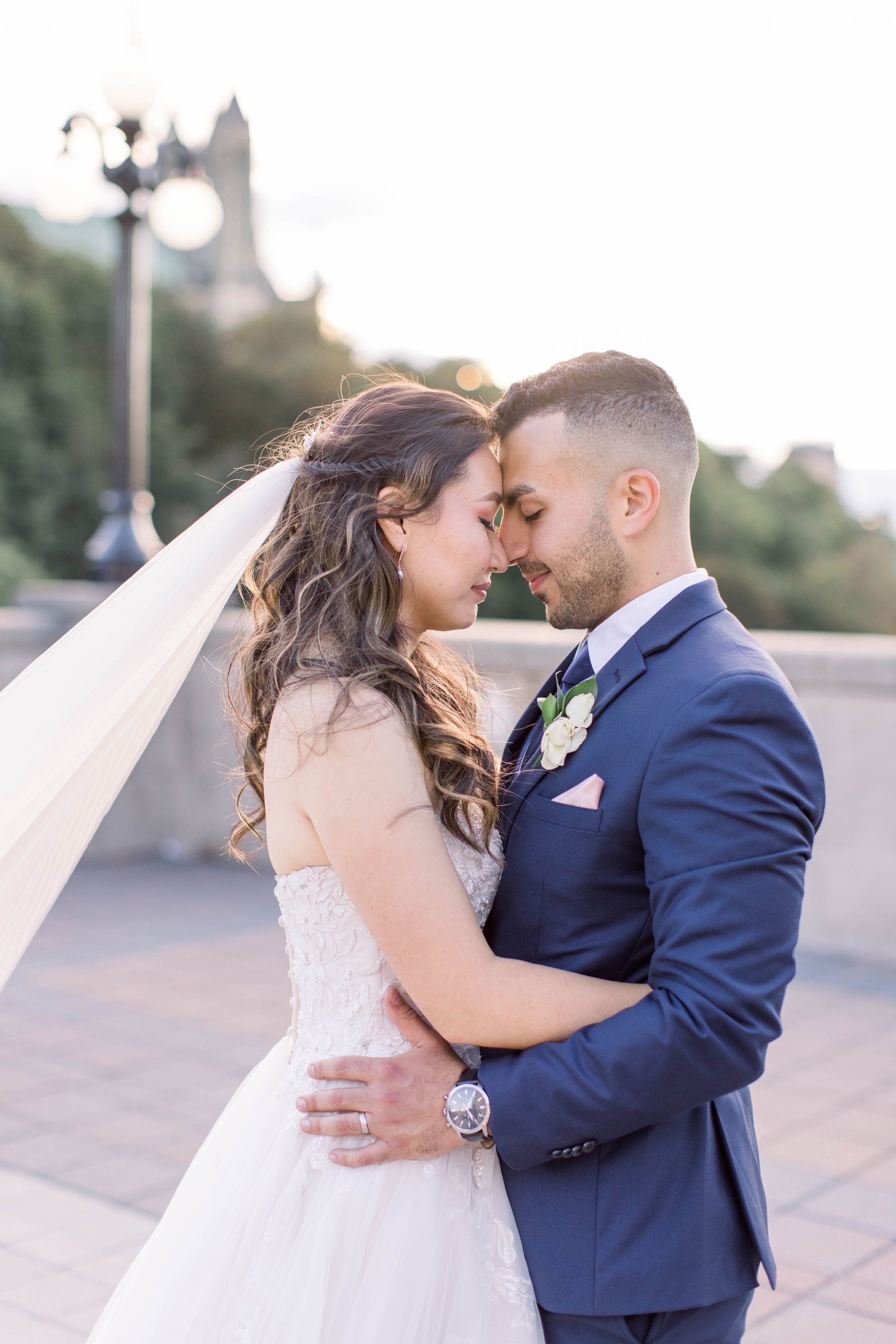  In Ottawa, a bride and groom close their eyes and put foreheads together by Chelsea Mason Photography. veil foreheads together #ChelseaMasonPhotography #ChelseaMasonWeddings #DowntownOttawa #FairmontChateauLaurier #OttawaWeddings #OttawaPhotographer