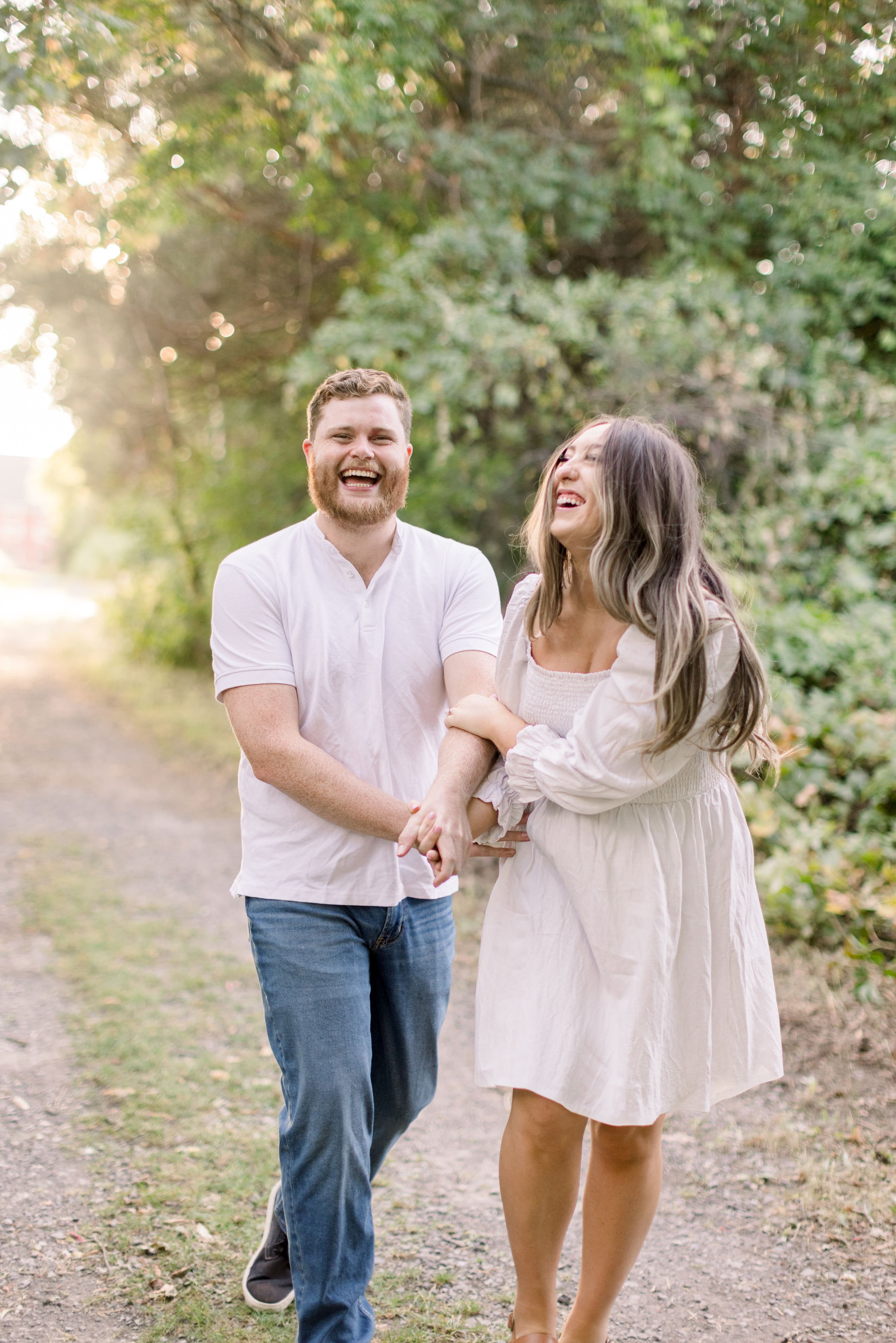  A cute couple laughing at one another was captured by Chelsea Mason Photography in Ottawa. Ottawa engagements laughing #ChelseaMasonPhotography #ChelseaMasonEngagements #Ottawaphotographers #ArboretumOttawaEngagments #weddingannouncementportraits 