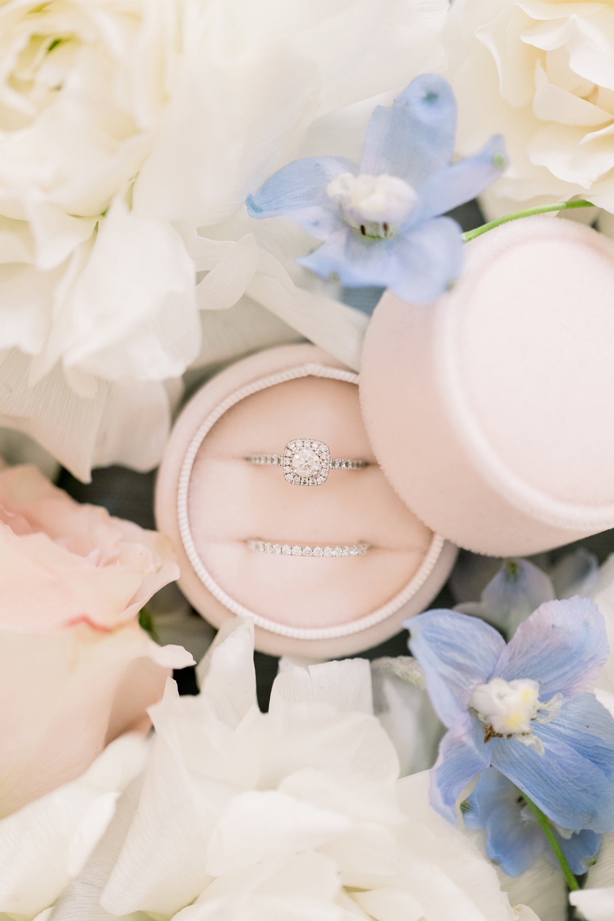  Silver vintage wedding rings in a blush pink box by Chelsea Mason Photography. bridal ring pink box spring florals for wedding #ChelseaMasonPhotography #ChelseaMasonWeddings #WakefieldWeddings #LeBelvedere #Wakefieldweddingphotographers 