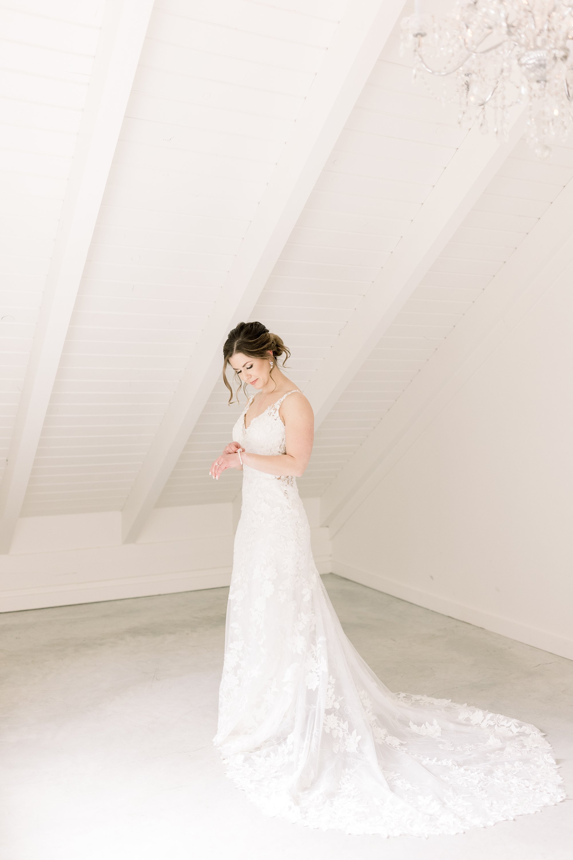  Chelsea Mason Photography captures a portrait of a bride getting ready in a white attic. bride gets ready bridal portrait #ChelseaMasonPhotography #ChelseaMasonWeddings #WakefieldWeddings #LeBelvedere #Wakefieldweddingphotographers 