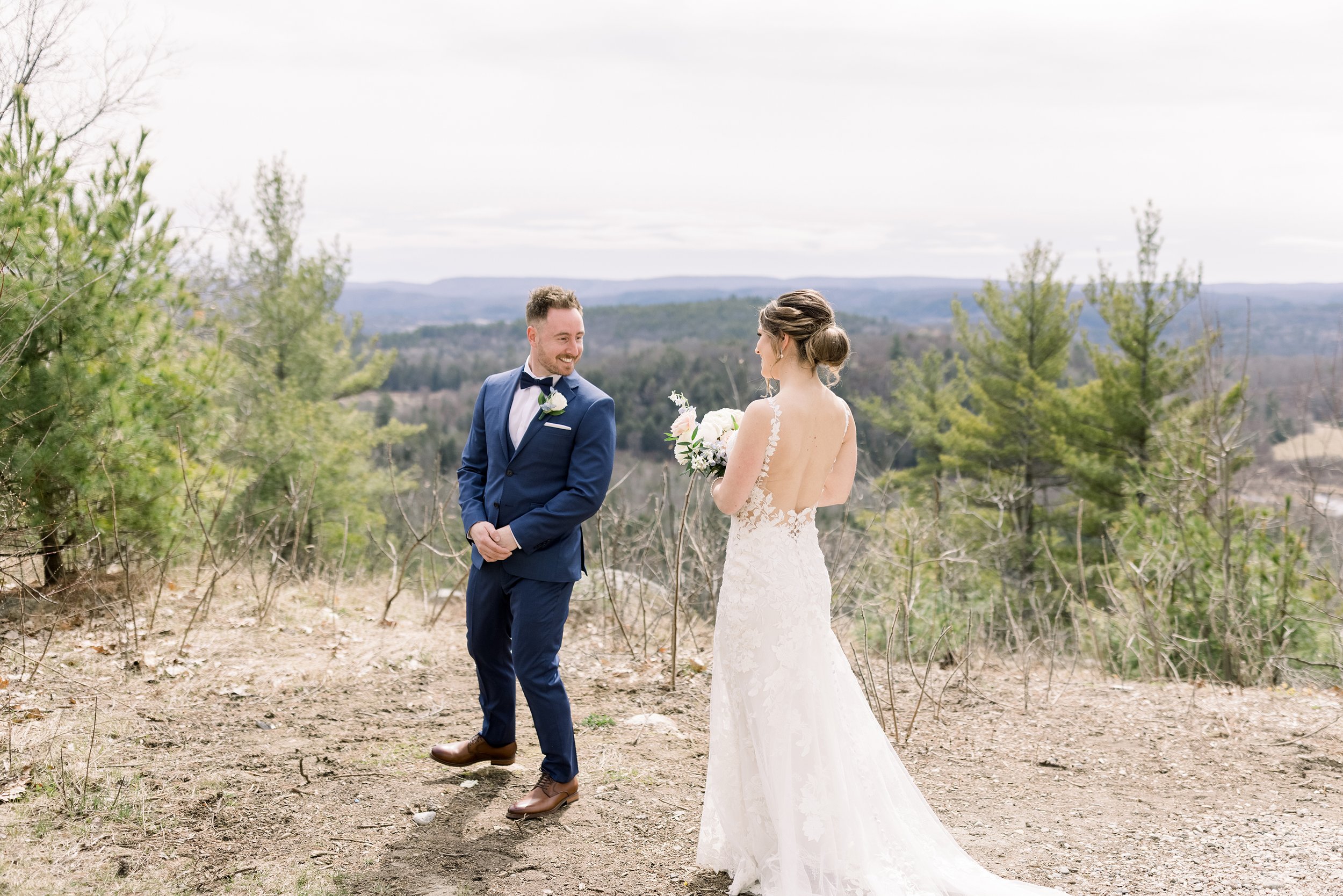  A bride surprises the groom during the first look at Le Belvedere by Chelsea Mason Photography. first look with groom #ChelseaMasonPhotography #ChelseaMasonWeddings #WakefieldWeddings #LeBelvedere #Wakefieldweddingphotographers 