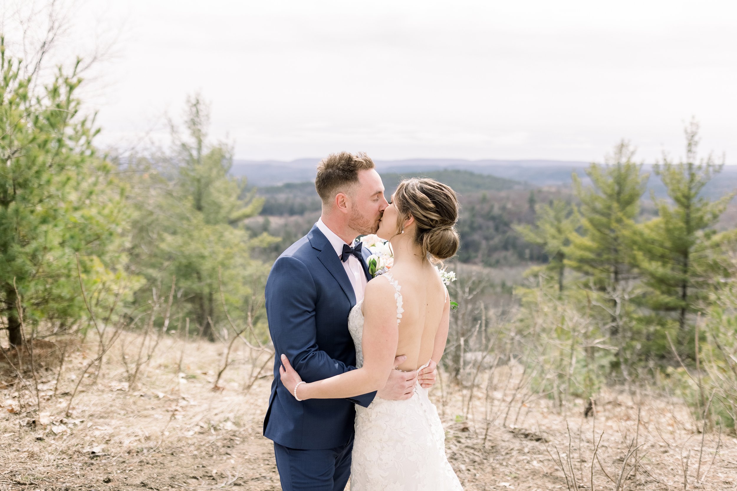  The bride and groom share a kiss on a mountain near Wakefield by Chelsea Mason Photography. newlyweds mountain wedding #ChelseaMasonPhotography #ChelseaMasonWeddings #WakefieldWeddings #LeBelvedere #Wakefieldweddingphotographers 