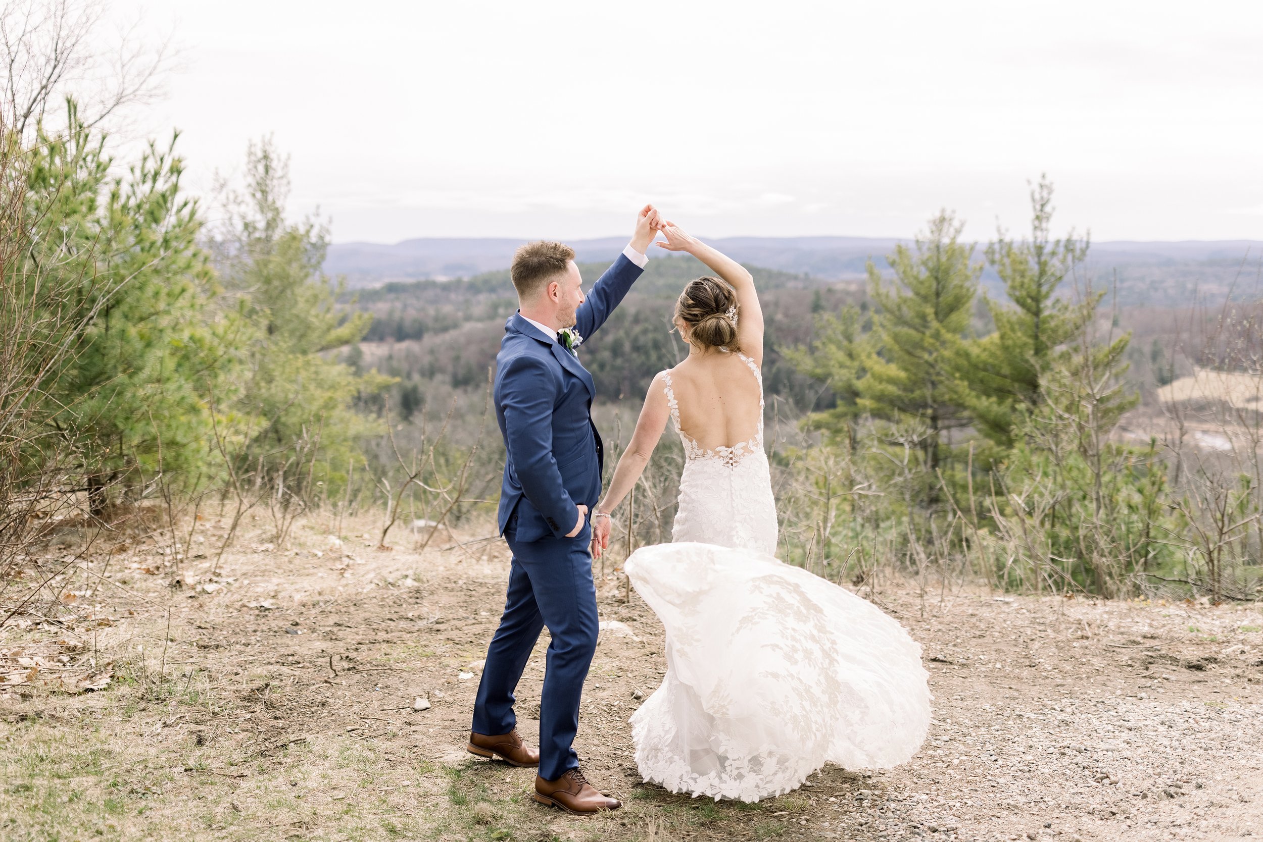  The groom twirls his bride around while dancing on a mountain by Chelsea Mason Photography. newlyweds dance twirl wedding gown #ChelseaMasonPhotography #ChelseaMasonWeddings #WakefieldWeddings #LeBelvedere #Wakefieldweddingphotographers 