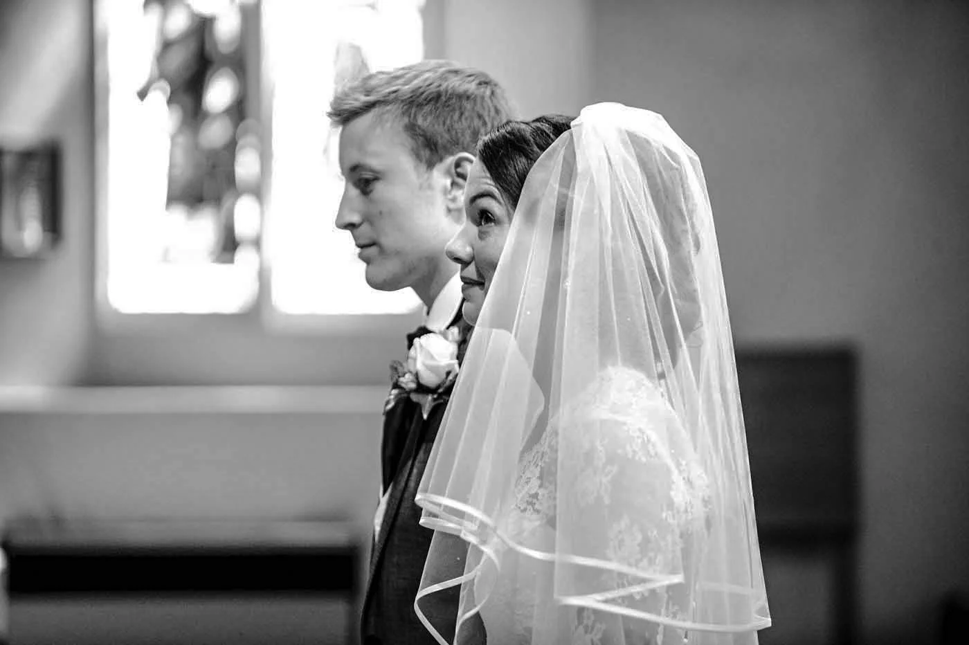 BRIDE-LOOKS-TO-HEAVENS-ST-MARYS-CHURCH-MERTON.jpg