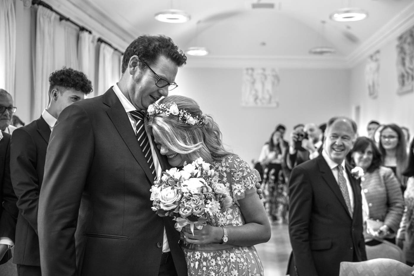 GROOM-EMBRACES-BRIDE-WEDDING-CEREMONY.jpg