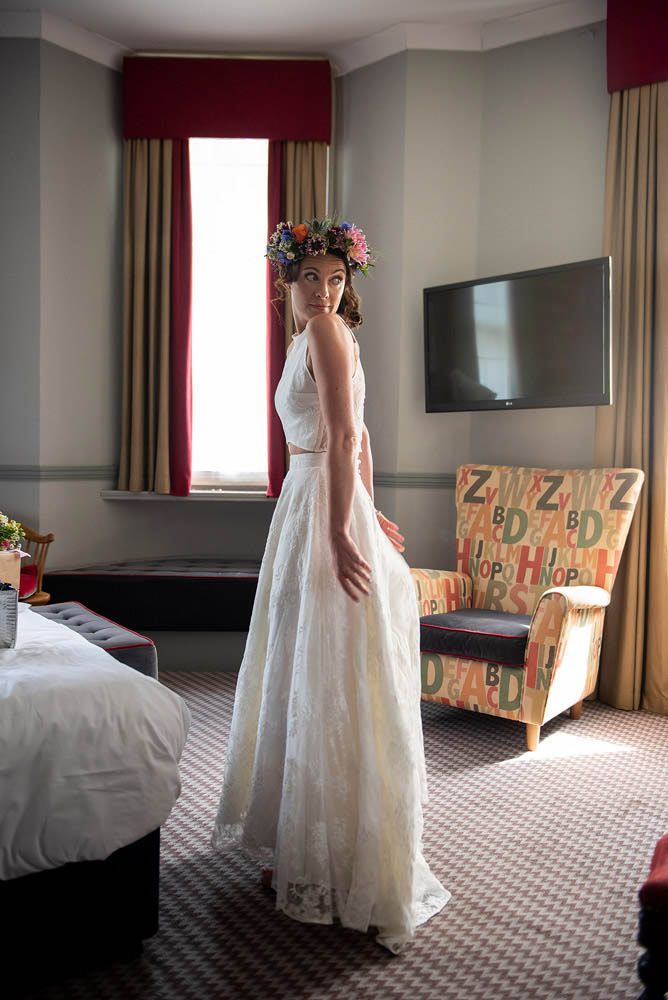 BRIDE-CHECKS-DRESS-IN-MIRROR.jpg