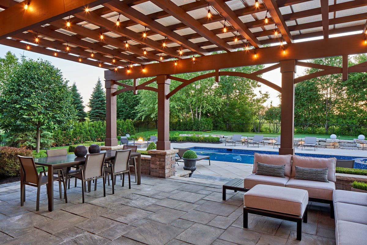 louvered roof pergola with string lights