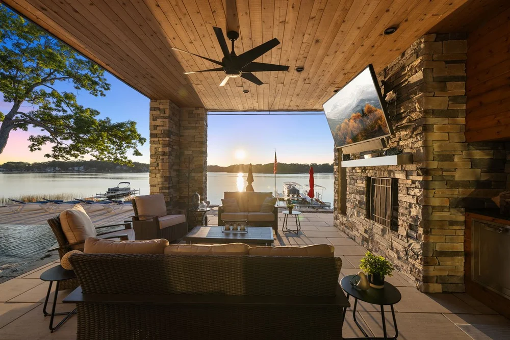 Lodge style outdoor living room overlooking lake