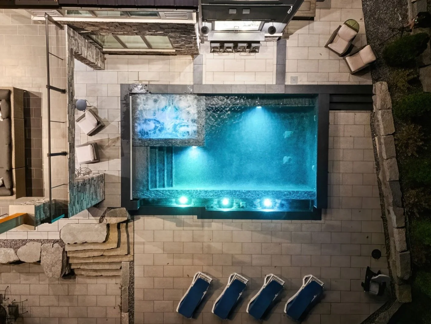 Brighton lakeside property with a cocktial size pool and spa with infinity edge overlooking the lake