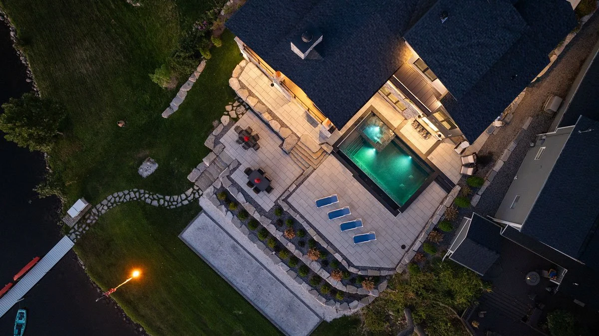 Brighton lakside property with a multi-level terrace featuring a cocktail pool and spa with infinity edge overlooking the lake