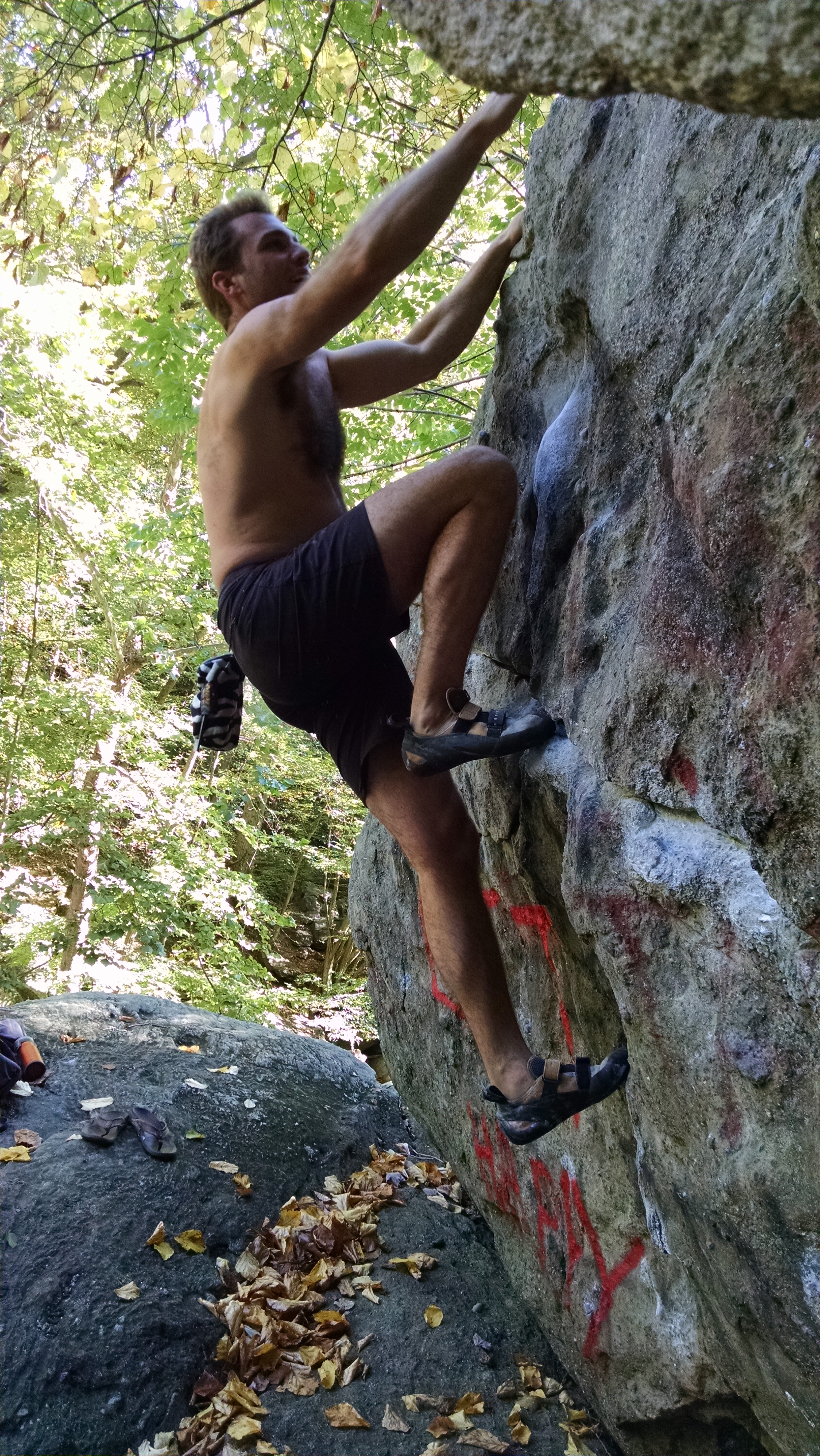 Zach bouldering by the Anacostia River; photo credit: Erik Murdock