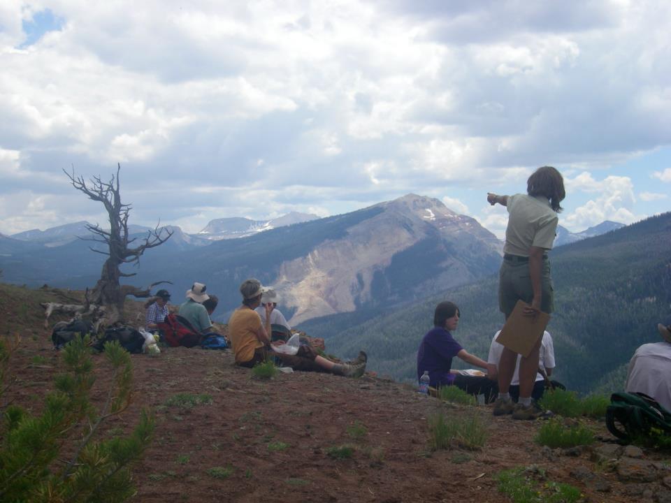 Linda describing the effects of a recent landslide in the forest.