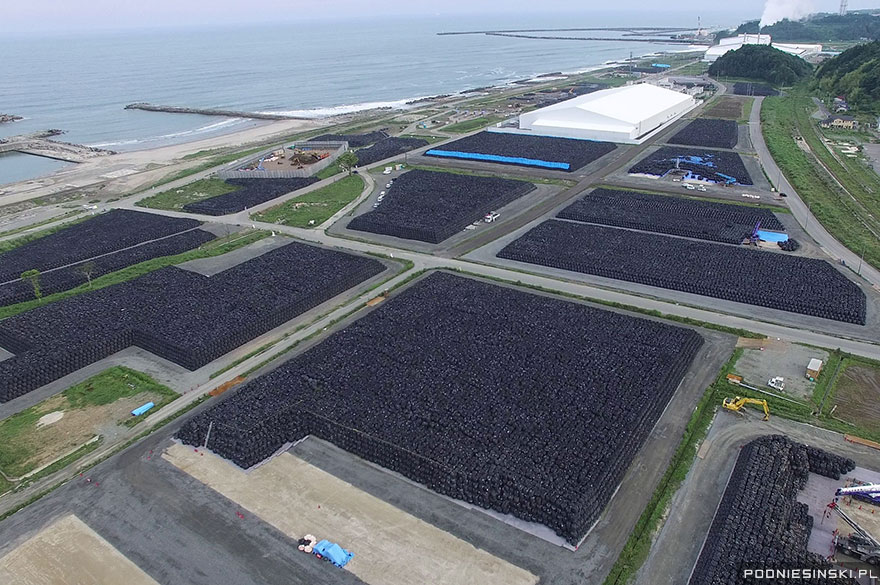 photo by Arkadiusz Podniesinski, Fukushima Daiichi Exclusion Zone , plastic bags of radioactive, nuke garbage sitting along the Pacific coastline