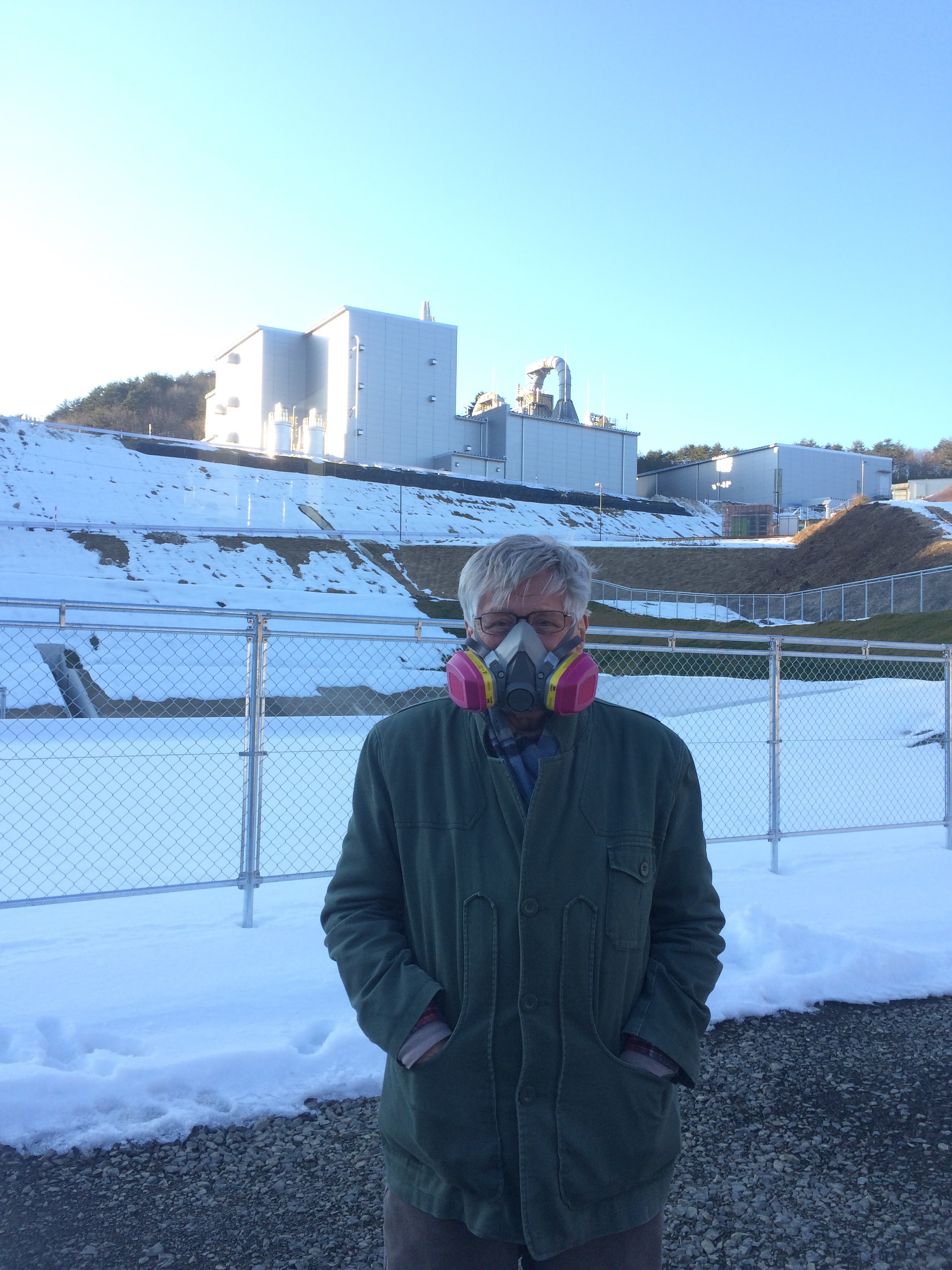 Wearing my respirator in front of the nuclear waste incinerator.