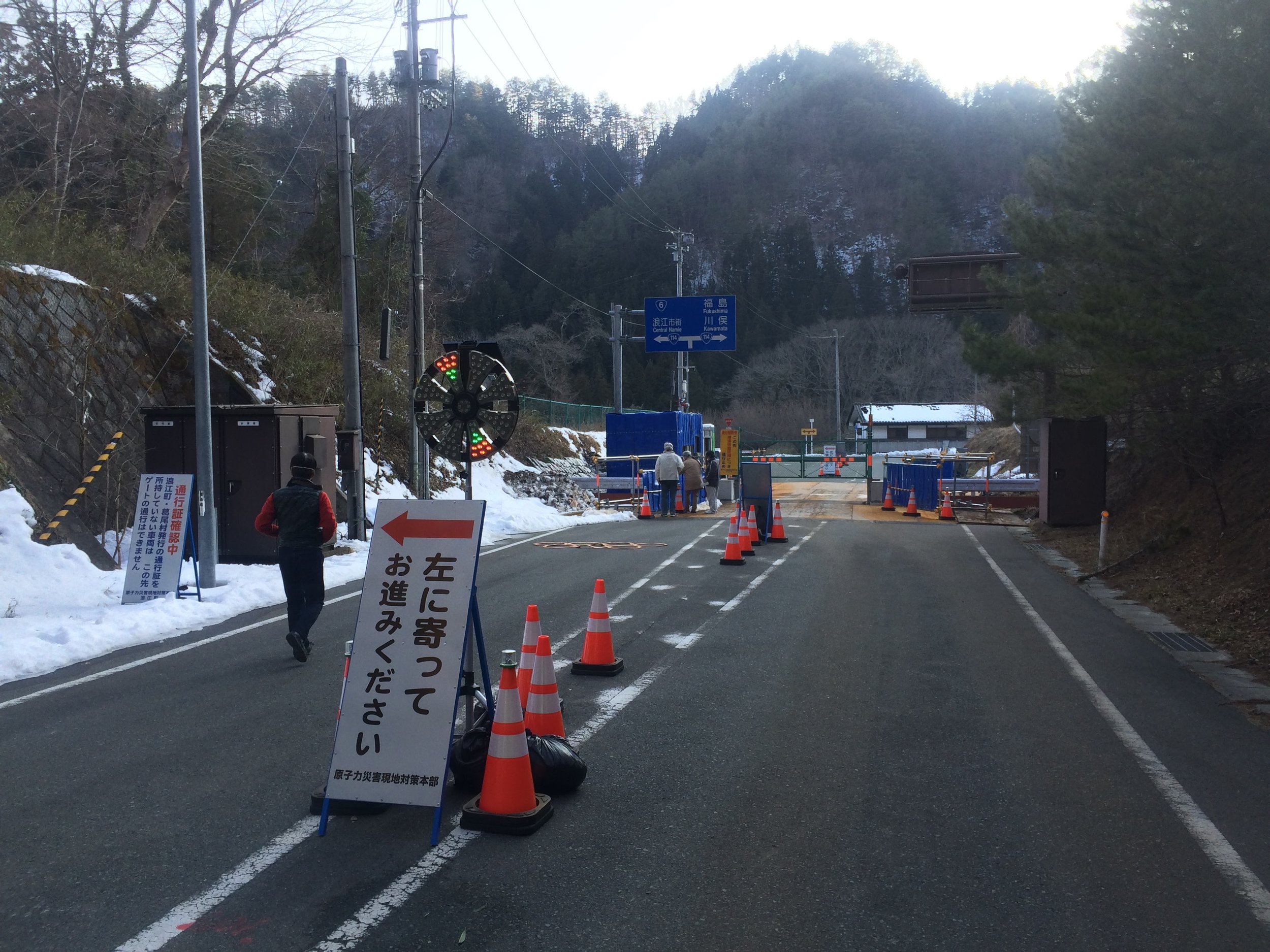 Blue guardhouse checkpoint on highly contaminated road. Guardhouse is lined with lead to protect the guard.