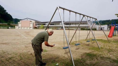 Marco Kaltofen taking samples on an abandoned playground in Fukushima Prefecture