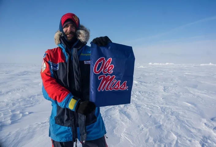 Hiker plants an Ole Miss flag at the North Pole