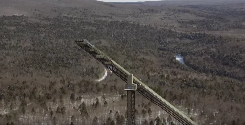Skier spins off 24-story ski jump, backwards