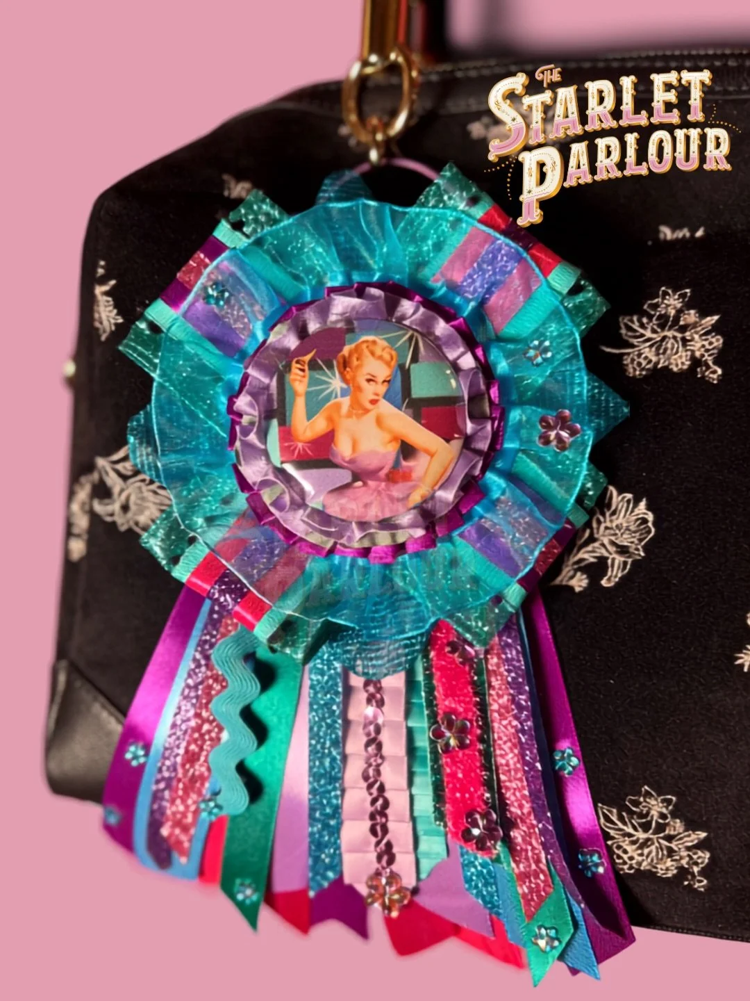 Thrilled to say this gorgeous gal has found a happy home but so many other Rosette beauties are now available in the shop. 💖💜🩵

Handcrafted retro rosettes inspired by vintage fairground prize ribbons can be shown off as a fun keychain or a pin-bac