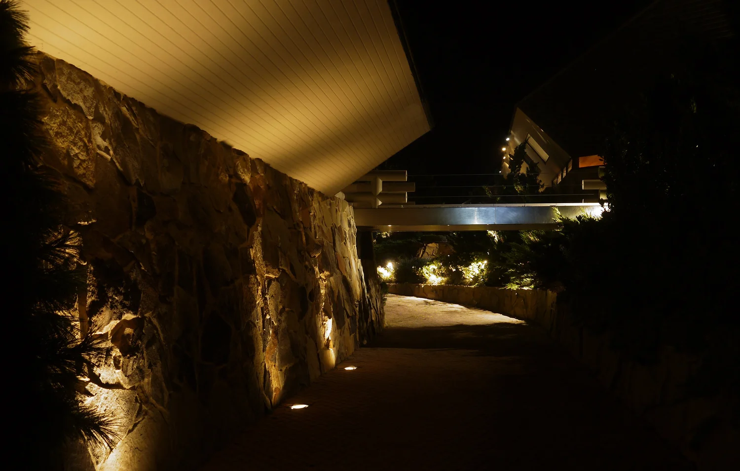 Lawn lighting at Southampton Hamptons estate — outdoor lighting across lawn and garden at night