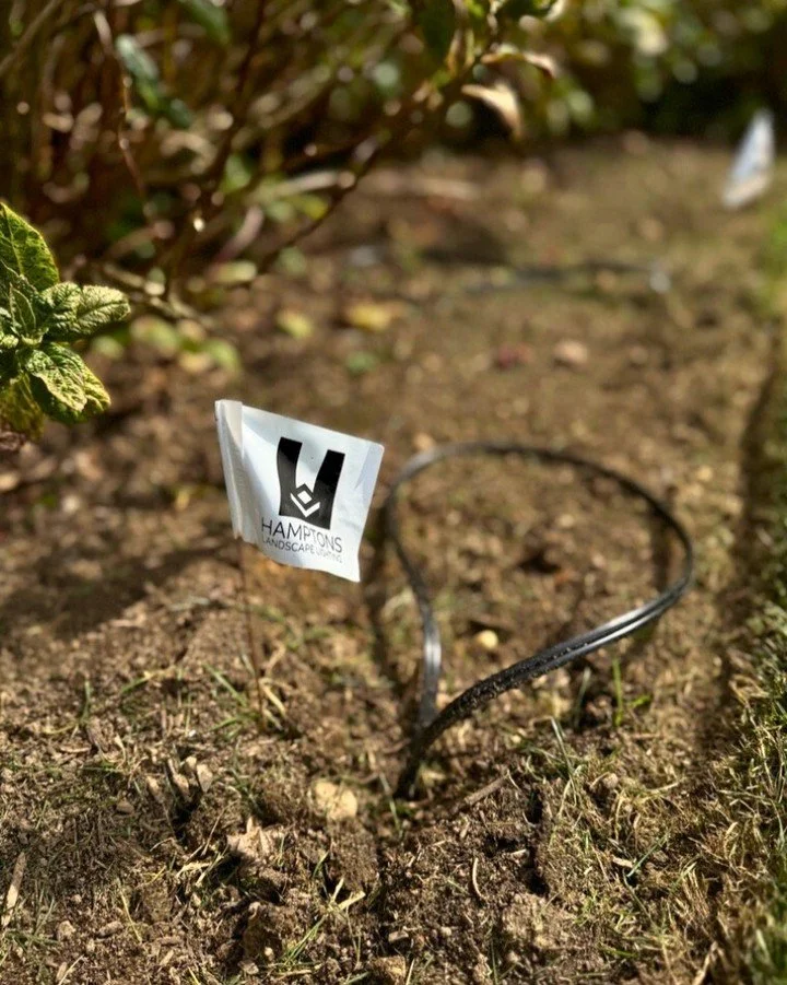 Do not let the size fool you, this tiny flag has big dreams! Today its just a marker, but soon it will be part of the reason neighbors stop and say wow when the sun goes down. 

#HamptonsLandscapeLighting #HamptonsHomes #LightUpYourLandscape 
#Lighti