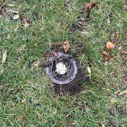 in-ground lighting fixture damaged by aerator