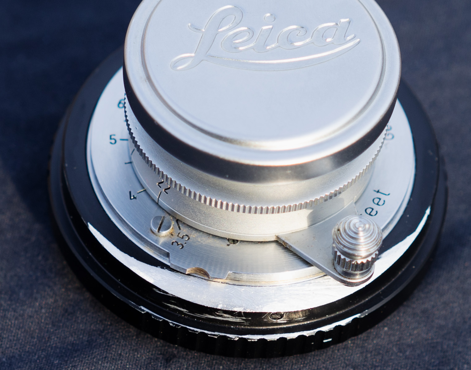 The focus button mechanism now has full clearance to get in and out of its locking infinity position.