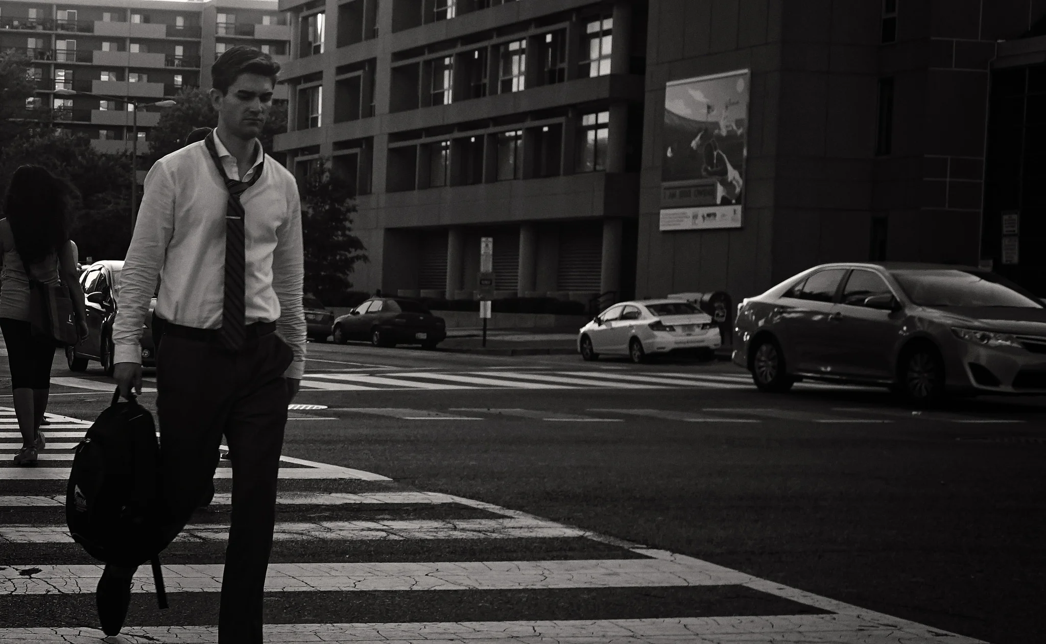 Rough Day. I'm tempted replace his backpack with a briefcase and the cars with 1960s Buicks and Fords.