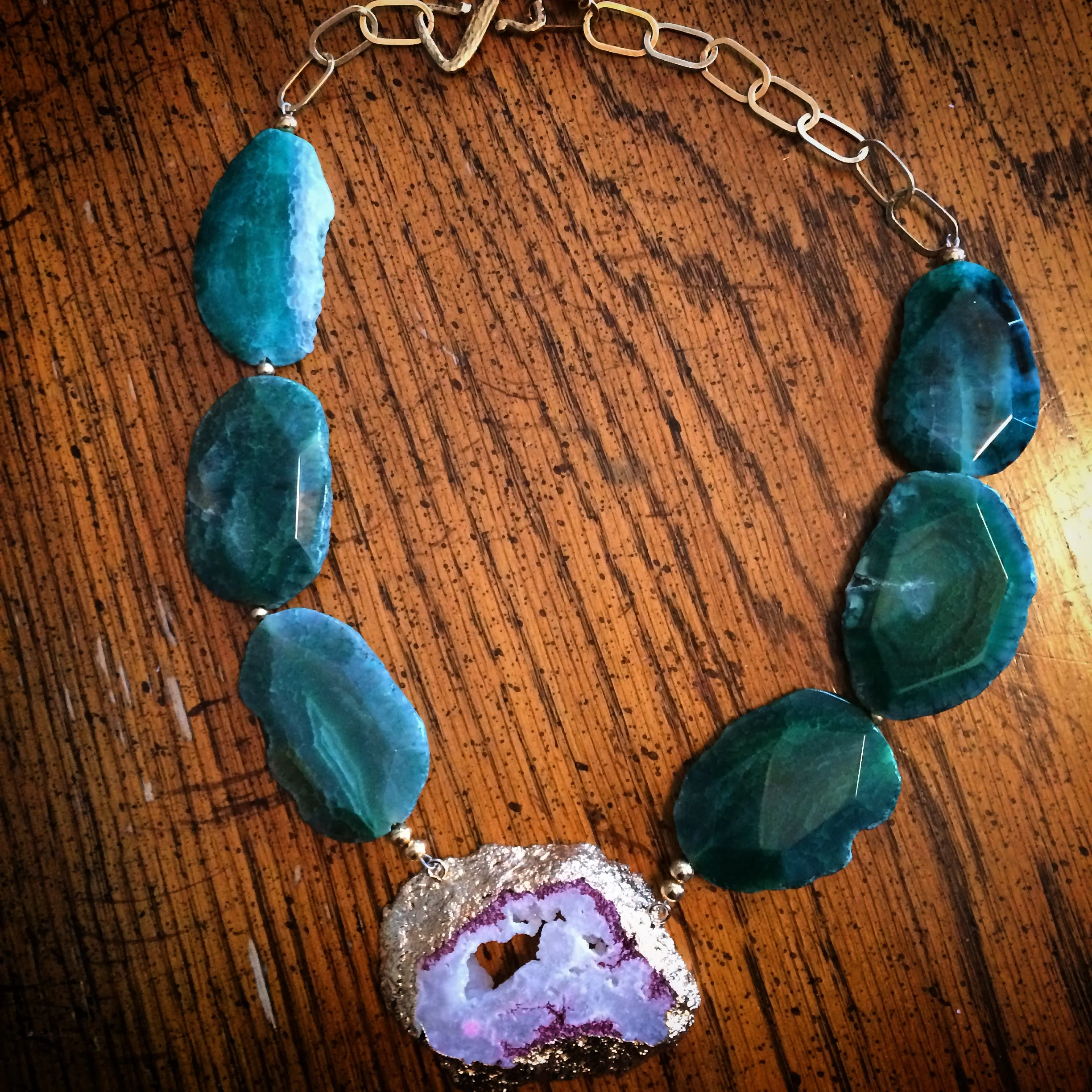  I recently found this amazing jewelry designer of TherArt and Le Obsession Boutique owner on Instagram, Teresa Habczyk . She makes the most AMAZING pieces and I am so happy to have found her. This gorgeous emerald green agate freeform and pink and white druzy crystal necklace was the most important accessory at my engagement party last weekend (well, besides my handsome fiance of course!) I paired it with a light pink romper with black lace, sheer black tights, and black lace pumps. The amount of compliments I received on my fabulous neck accessory was out of this world! Scroll down to check out more pics, the outfit, and more about the designer herself. Then shop online here: https://www.etsy.com/shop/teresajewelry