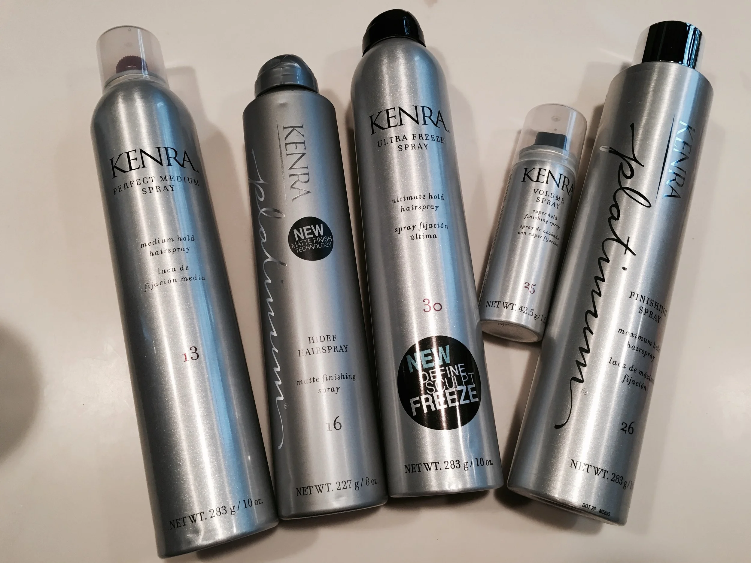  I have gone through and tried each of these products with a handful of different hairstyles and I have to say they all serve the purpose they say they do! The scents, the lightweight application, and the amazing hold of these Kenra Professional products is amazing and I am so in love with them that I have already recommended them to a bunch of my beauty loving friends! About the Product Kenra Perfect Medium Spray 13 Perfect Medium Spray 13 combines styling control with a touchable, brush-through hold. This medium hold spray is fast-drying and finishes with a high shine. - Provides styling control without stiffness - Fast-drying formulation for touchable, moveable, brush-through hold - Finishes with high shine “It’s amazing for working with the style, for a flexible finish, and to help with static and fly aways.” ~Laken Rose, Director of Education, Kenra Professional Kenra Platinum HiDEF Hairspray 16 HiDEF Hairspray 16 is a light-defusing finishing spray that holds tousled, undone styles with a matte, flake-free finish. This brushable, humidity resistant hairspray instantly dries on contact, giving any style an airy, windblown finish. The perfect finishing spray for any textured style. - Diffuses light for a long-lasting matte finishing effect - Controls and sets texture, body and fullness - Delivers the most natural looking hold on undone styles - Ultra fine mist instantly dries on contact “Love to use this hairspray to lock in a beachy wave look after using Kenra Platinum Dry Texture Spray 6 for an undone, matte finish.” ~Laken Rose, Director of Education, Kenra Professional Kenra Volume Spray 25 Volume Spray 25 provides the maximum amount of volume and hold possible. It leaves hair looking natural and shiny while imparting the strength and volume necessary to make any style last all day. - Super hold up to 120 hours - 24 hour high humidity resistance - Wind resistant up to 25 MPH - Flake-free - Fast-drying “Excellent all around hairspray. It does so much. It can create volume with a high hold, but also with humidity resistance for everyday use!” ~Laken Rose, Director of Education, Kenra Professional Kenra Platinum Finishing Spray 26 Finishing Spray 26 is the ultimate firm hold hairspray, providing maximum control with long-lasting lift and style retention. Its fast drying, humidity resistant formulation finishes styles with high shine, and it is completely shampoo soluble. - All-day style retention - Provides maximum control with long-lasting lift and style support - Fast-drying, non-flaking, non-drying - Humidity-resistant - Finishes with high shine - Helps extend the life of color “This hairspray is great for textured hair and has all the benefits of Volume Spray 25, but with a higher shine.” ~Laken Rose, Director of Education, Kenra Professional Kenra Ultra Freeze Spray 30 Ultra Freeze Spray 30 locks styles in place with a long-lasting, ultra-firm hold. This fast-drying formula defines, sculpts and freezes styles in place, while providing humidity resistance with a high shine, flake-free finish. - Long-lasting, ultra-firm hold - Dries instantly - Humidity Resistant - Flake-free - High shine finish “For the ultimate high hold that will last all day long!” ~Laken Rose, Director of Education, Kenra Professional About the Product Kenra Perfect Medium Spray 13 Perfect Medium Spray 13 combines styling control with a touchable, brush-through hold. This medium hold spray is fast-drying and finishes with a high shine. - Provides styling control without stiffness - Fast-drying formulation for touchable, moveable, brush-through hold - Finishes with high shine “It’s amazing for working with the style, for a flexible finish, and to help with static and fly aways.” ~Laken Rose, Director of Education, Kenra Professional Kenra Platinum HiDEF Hairspray 16 HiDEF Hairspray 16 is a light-defusing finishing spray that holds tousled, undone styles with a matte, flake-free finish. This brushable, humidity resistant hairspray instantly dries on contact, giving any style an airy, windblown finish. The perfect finishing spray for any textured style. - Diffuses light for a long-lasting matte finishing effect - Controls and sets texture, body and fullness - Delivers the most natural looking hold on undone styles - Ultra fine mist instantly dries on contact “Love to use this hairspray to lock in a beachy wave look after using Kenra Platinum Dry Texture Spray 6 for an undone, matte finish.” ~Laken Rose, Director of Education, Kenra Professional Kenra Volume Spray 25 Volume Spray 25 provides the maximum amount of volume and hold possible. It leaves hair looking natural and shiny while imparting the strength and volume necessary to make any style last all day. - Super hold up to 120 hours - 24 hour high humidity resistance - Wind resistant up to 25 MPH - Flake-free - Fast-drying “Excellent all around hairspray. It does so much. It can create volume with a high hold, but also with humidity resistance for everyday use!” ~Laken Rose, Director of Education, Kenra Professional Kenra Platinum Finishing Spray 26 Finishing Spray 26 is the ultimate firm hold hairspray, providing maximum control with long-lasting lift and style retention. Its fast drying, humidity resistant formulation finishes styles with high shine, and it is completely shampoo soluble. - All-day style retention - Provides maximum control with long-lasting lift and style support - Fast-drying, non-flaking, non-drying - Humidity-resistant - Finishes with high shine - Helps extend the life of color “This hairspray is great for textured hair and has all the benefits of Volume Spray 25, but with a higher shine.” ~Laken Rose, Director of Education, Kenra Professional Kenra Ultra Freeze Spray 30 Ultra Freeze Spray 30 locks styles in place with a long-lasting, ultra-firm hold. This fast-drying formula defines, sculpts and freezes styles in place, while providing humidity resistance with a high shine, flake-free finish. - Long-lasting, ultra-firm hold - Dries instantly - Humidity Resistant - Flake-free - High shine finish “For the ultimate high hold that will last all day long!” ~Laken Rose, Director of Education, Kenra Professional Learn About the Brand Kenra Professional® is a purely professional brand dedicated to understanding and serving today’s stylists. Our passion is developing best-in-class innovations, delivering superior and reliable results. Kenra Professional strives to elevate the stylists’ artistry and craft. Three unique brands, Kenra, Kenra Platinum, and Kenra Color, are each driven by the daily needs of stylists. A complete range of high-performance products combined with straightforward and accessible education gives stylists the confidence to address every client’s need. *Shop online here: http://www.kenraprofessional.com Stay Beautiful Chicago, Katie