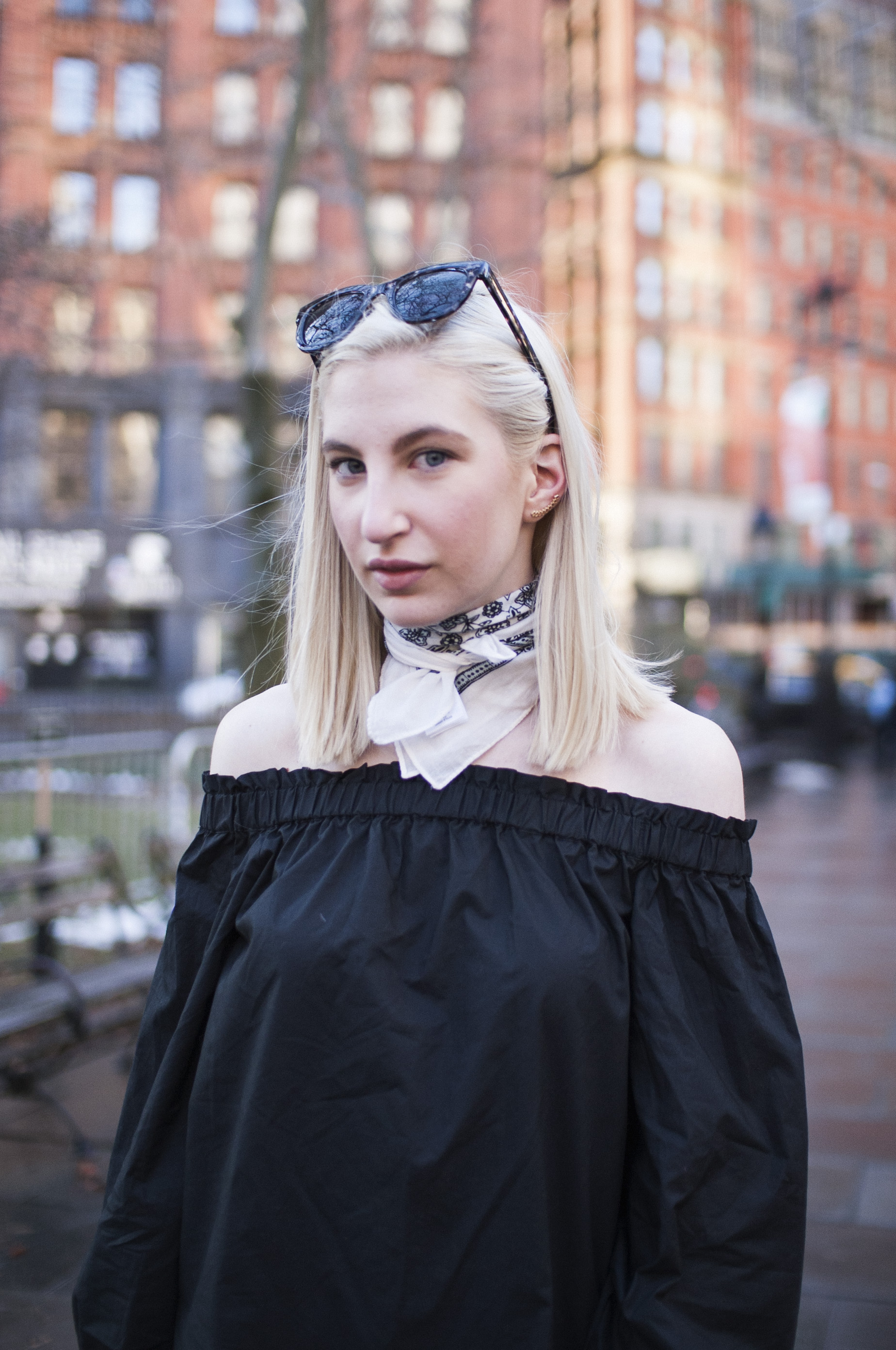 Audra Koch - J.Crew black longsleeve off the shoulder top, lookout high rise jeans, black block heel ankle boots, white bandana neck scarf, ear crawlers from Rocksbox