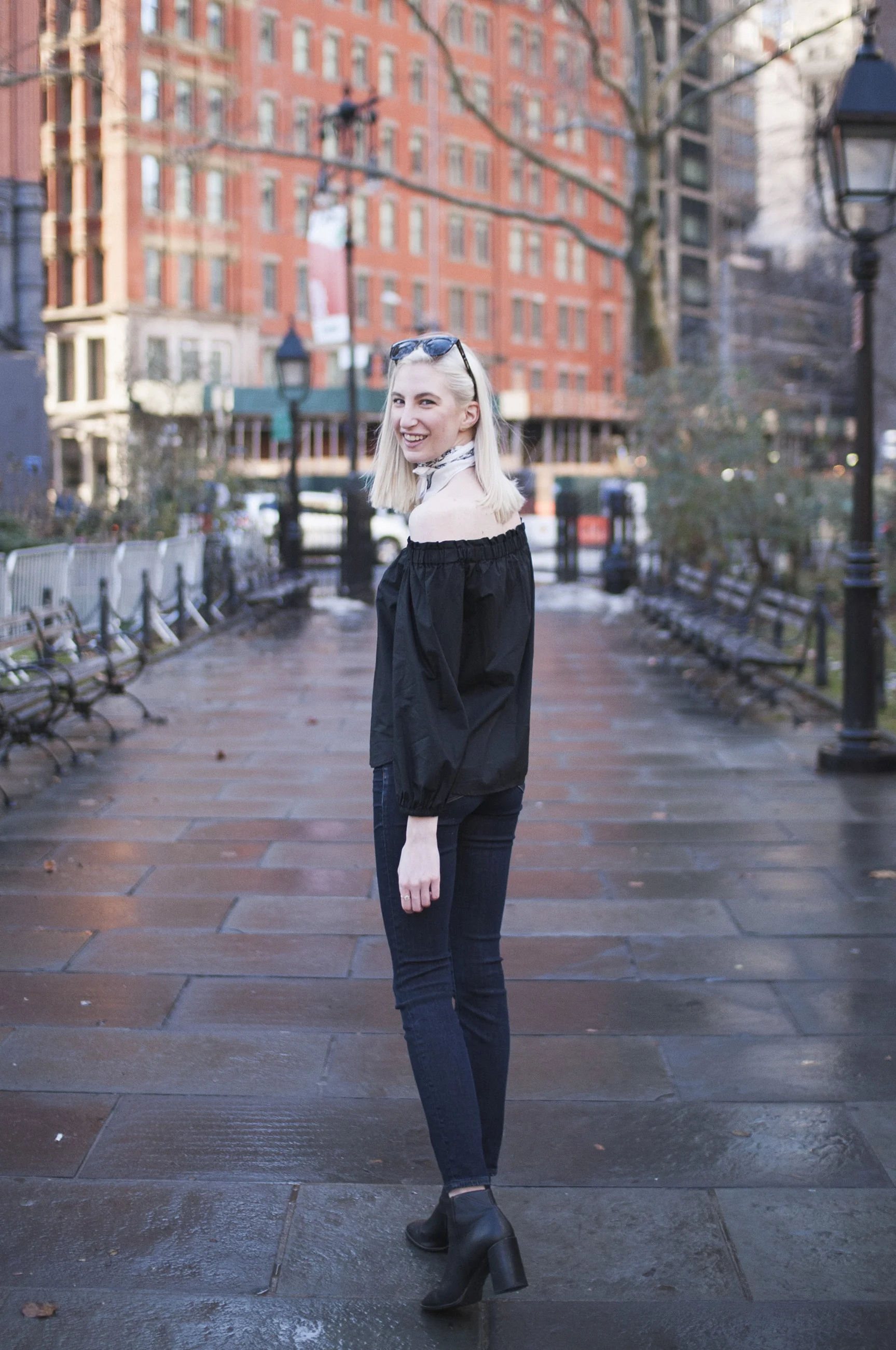 Audra Koch - J.Crew black longsleeve off the shoulder top, lookout high rise jeans, black block heel ankle boots, white bandana neck scarf, ear crawlers from Rocksbox