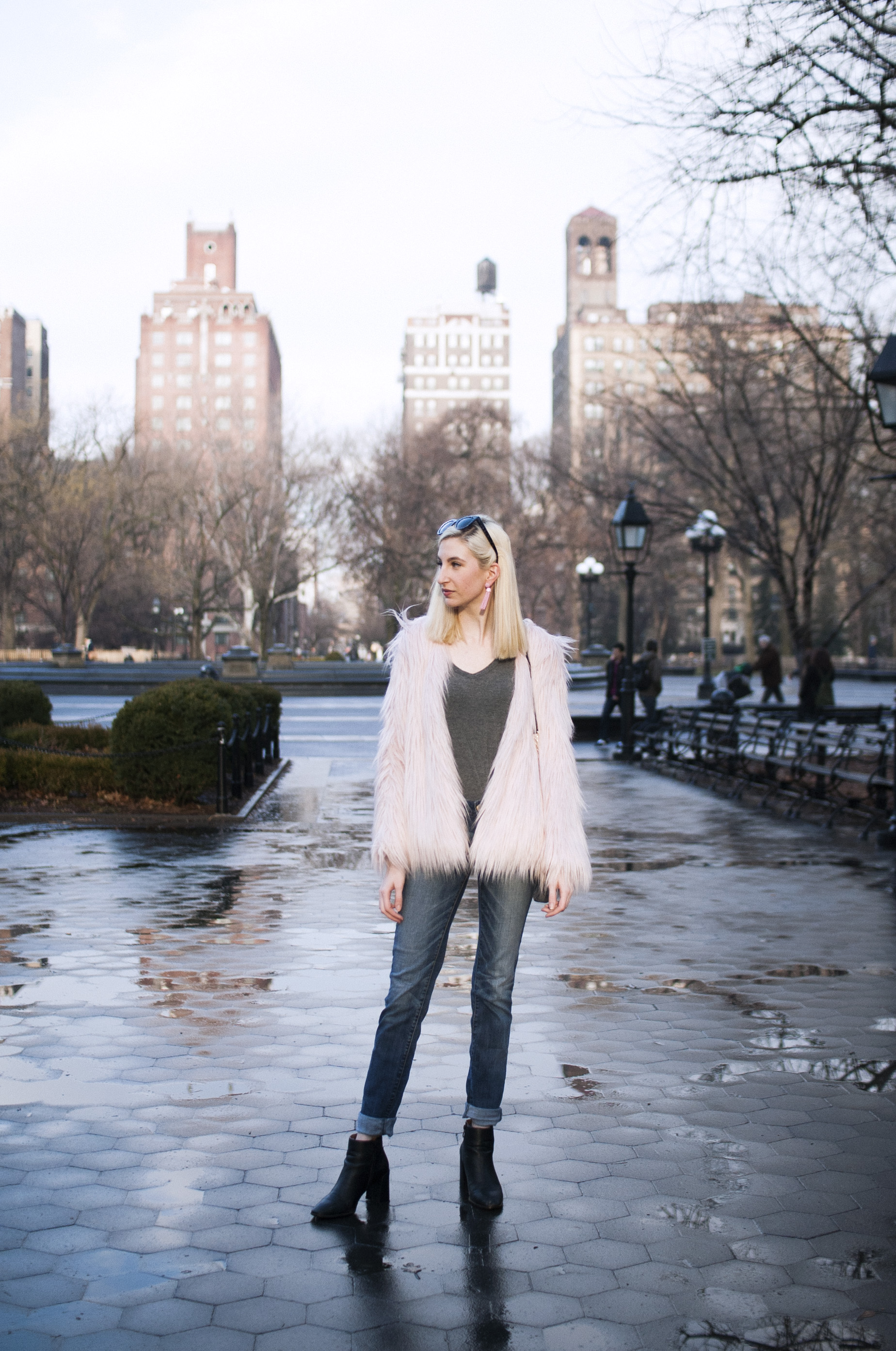 pink faux-fur jacket, relaxed jeans, grey tee, black block heeled booties, pink tassel earrings