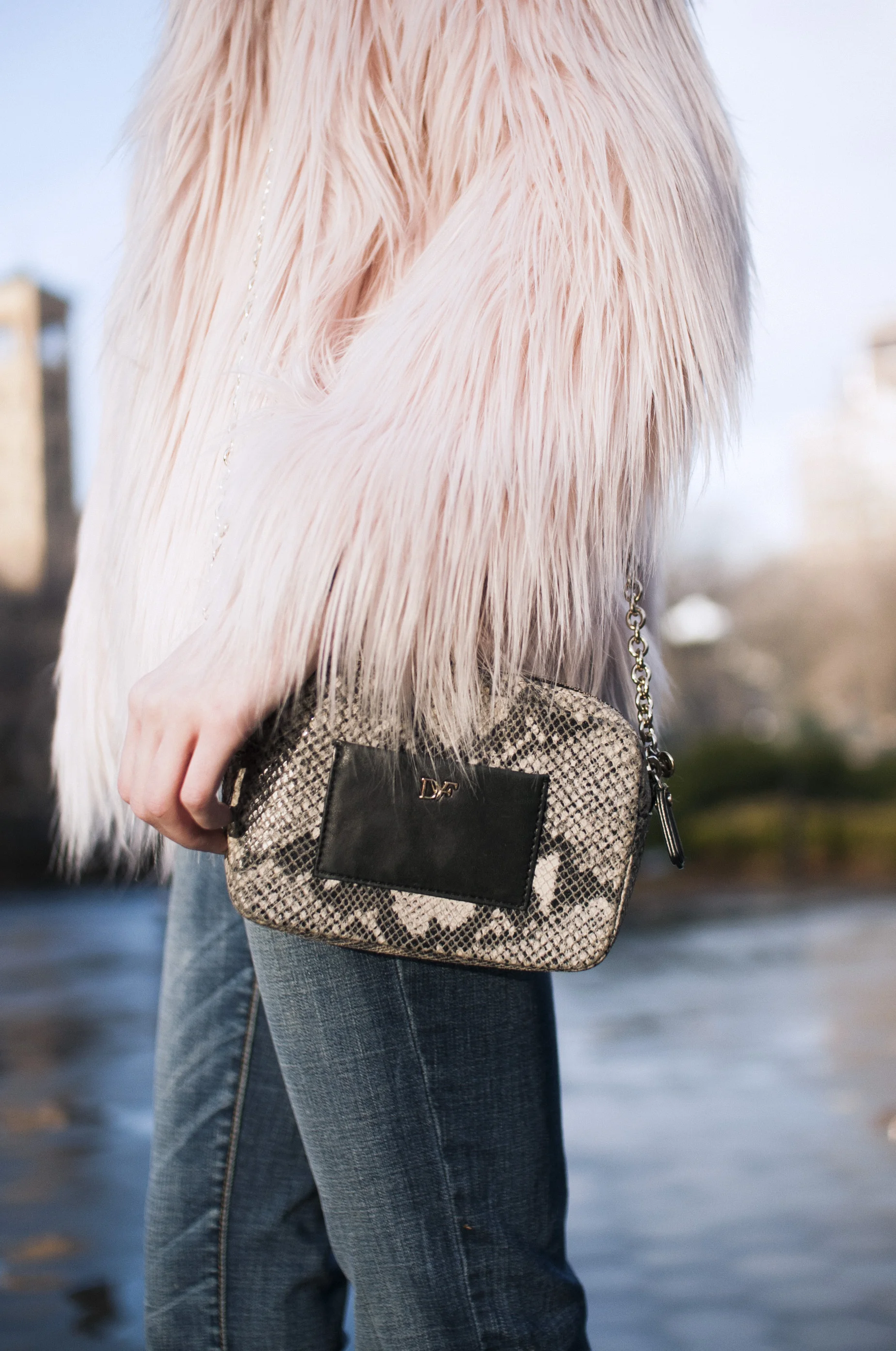 pink faux-fur jacket, relaxed jeans, grey tee, black block heeled booties, pink tassel earrings