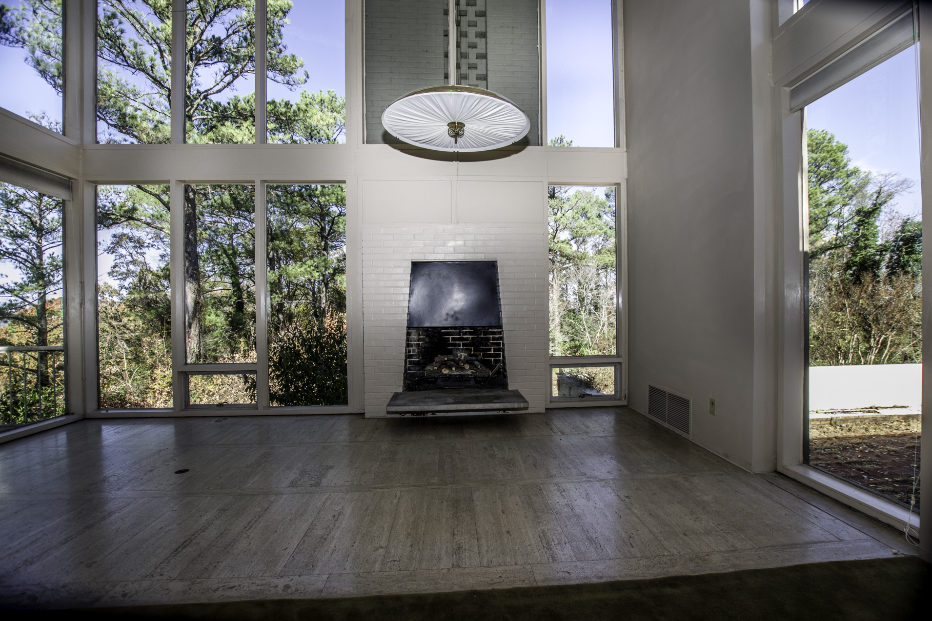 The living room has original travertine flooring.