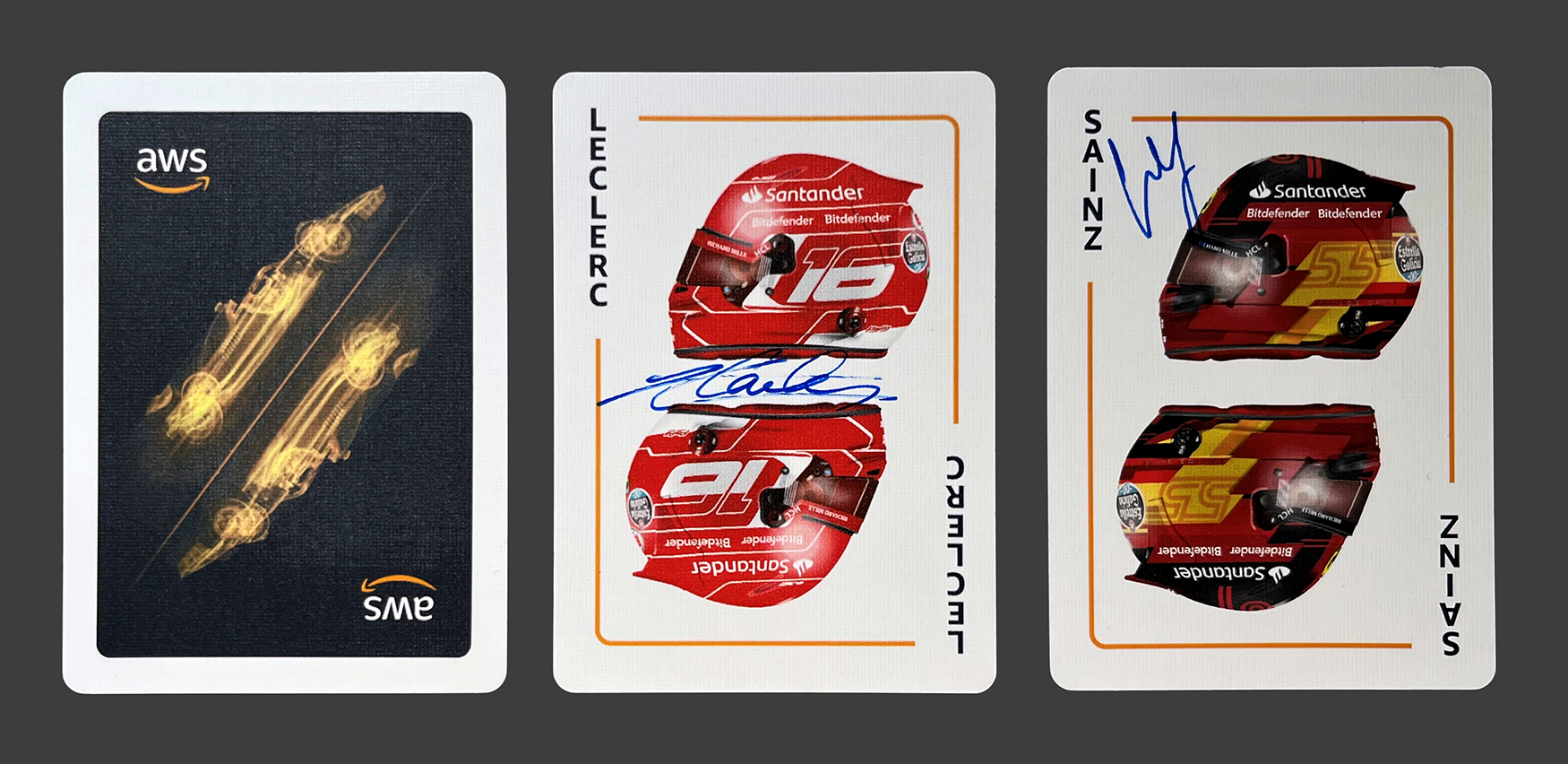 Playing cards signed by Charles Lelerc and Carlos Sainz.