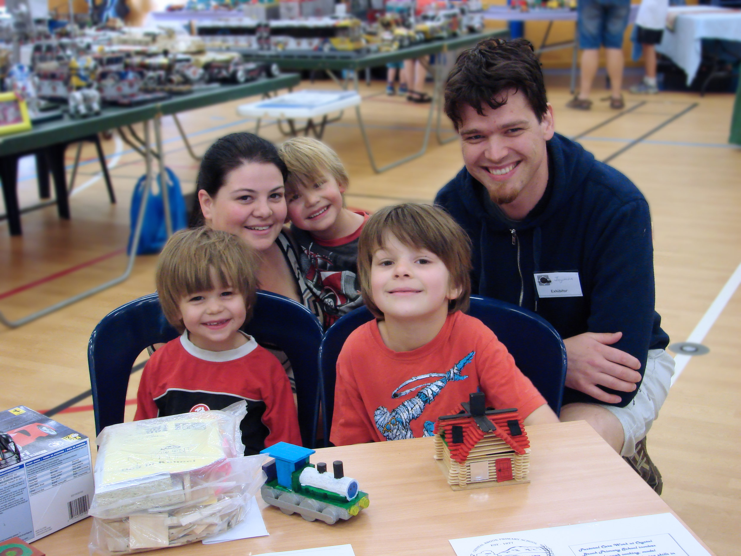 Left to right: Izaiah, Samantha, Zachary, Logan and Jaymon Wurst with the model house that Logan made.
