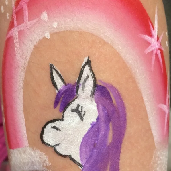 ASD Support Group child shows off the result of the Face Painting Activity during the Purple Picnic on January 12