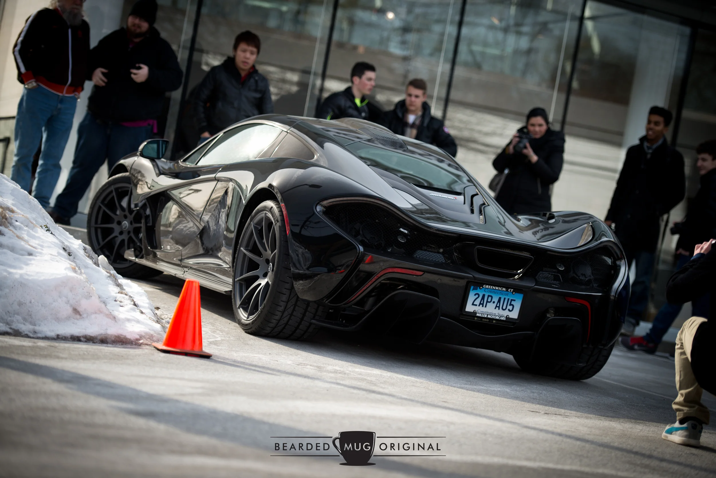 The fourth P1 was much less outgoing, its muted black paint, dormant rear wing, and added road salt helping it to blend in with the more pedantic cars of Greenwich traffic.