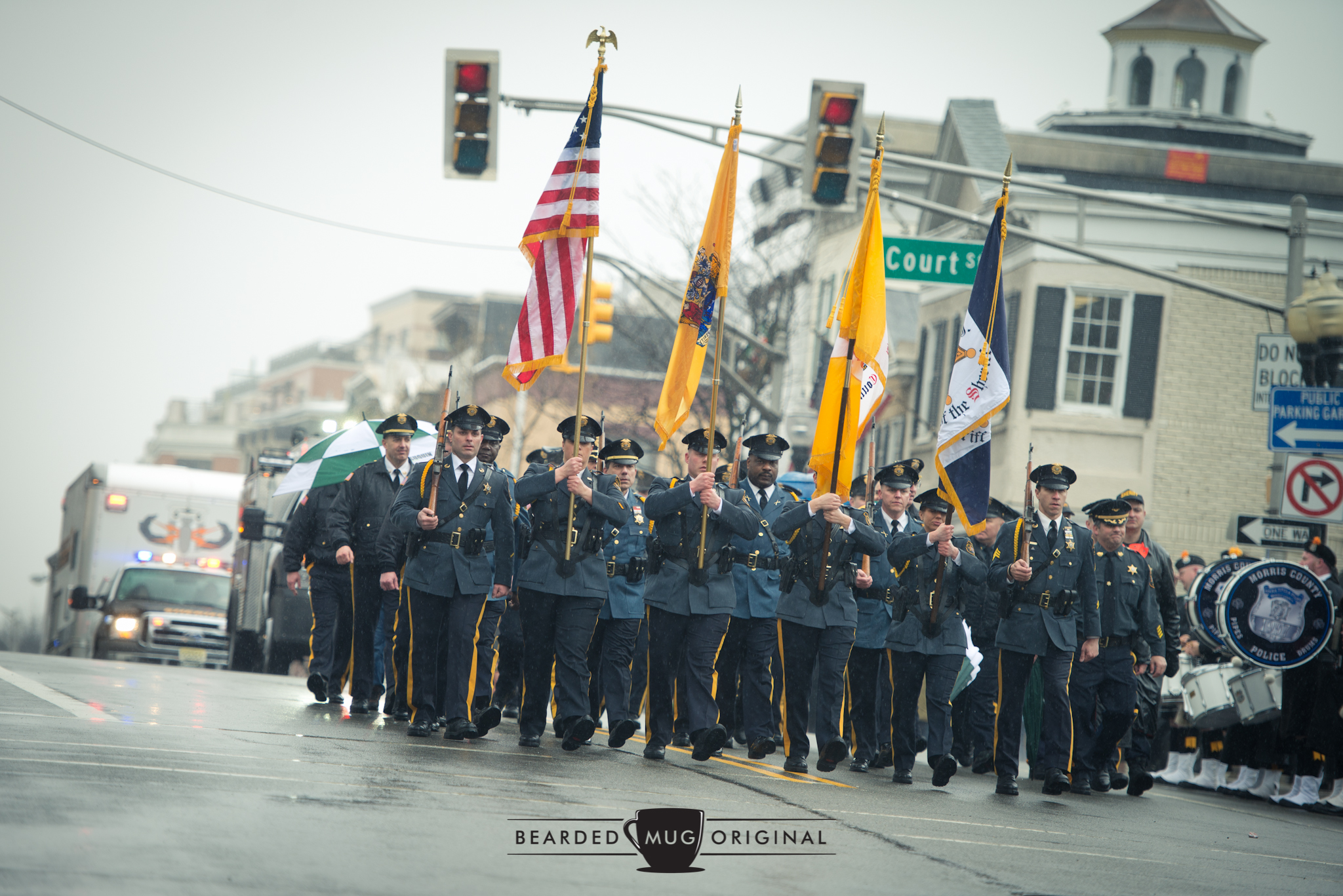 Left, left, left, right: The Sheriff's Office marches in step over the hill by Court Street, in front of the Morris County Courthouse.